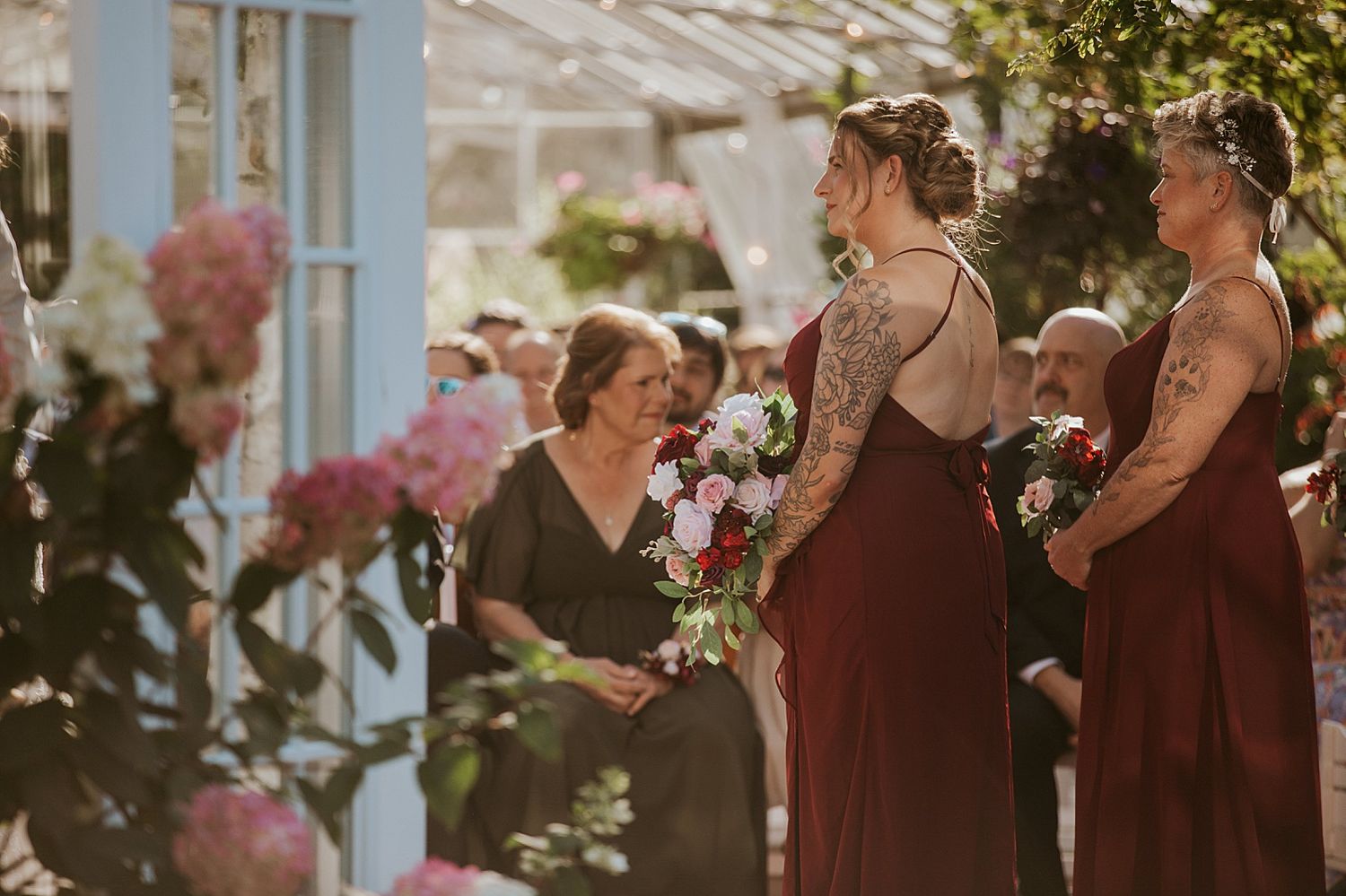 Bridesmaids wearing deep red at a New Hampshire wedding ceremony