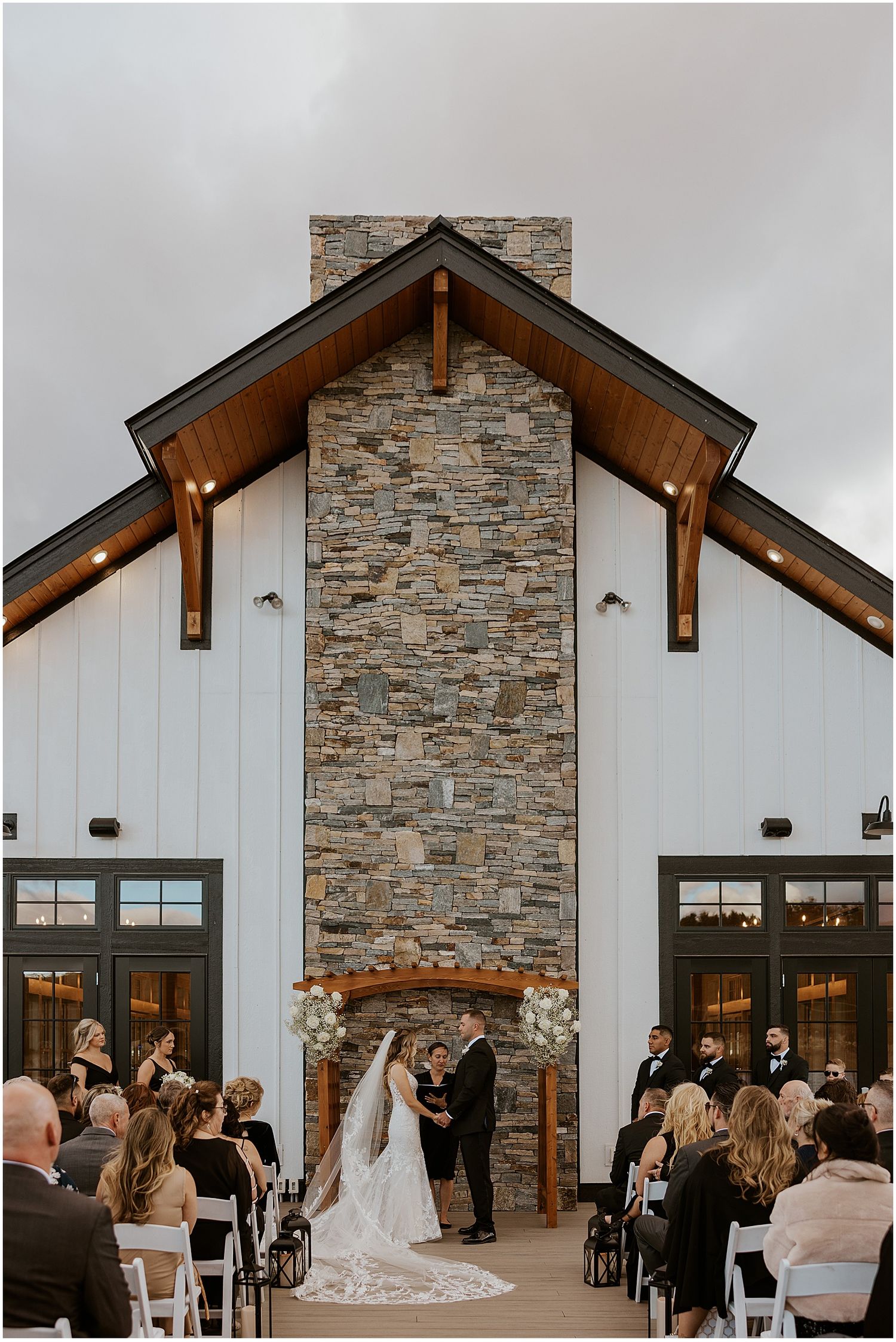 NH couple at their wedding ceremony at the Owls Nest Resort, one of the best outdoor wedding venues in NH