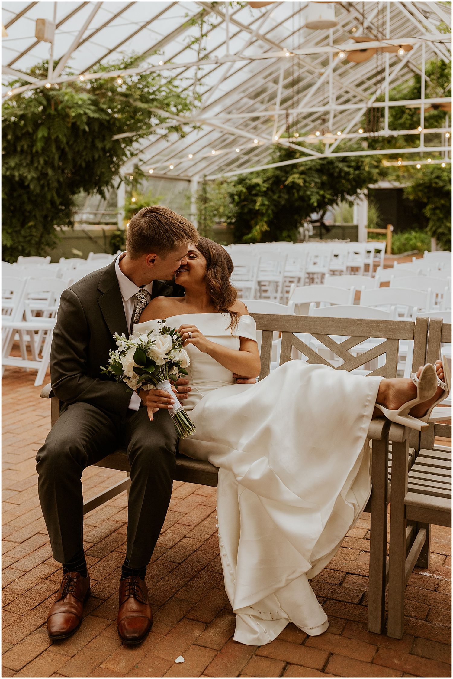 Bride and groom at the Barn on the Pemi in greenhouse
