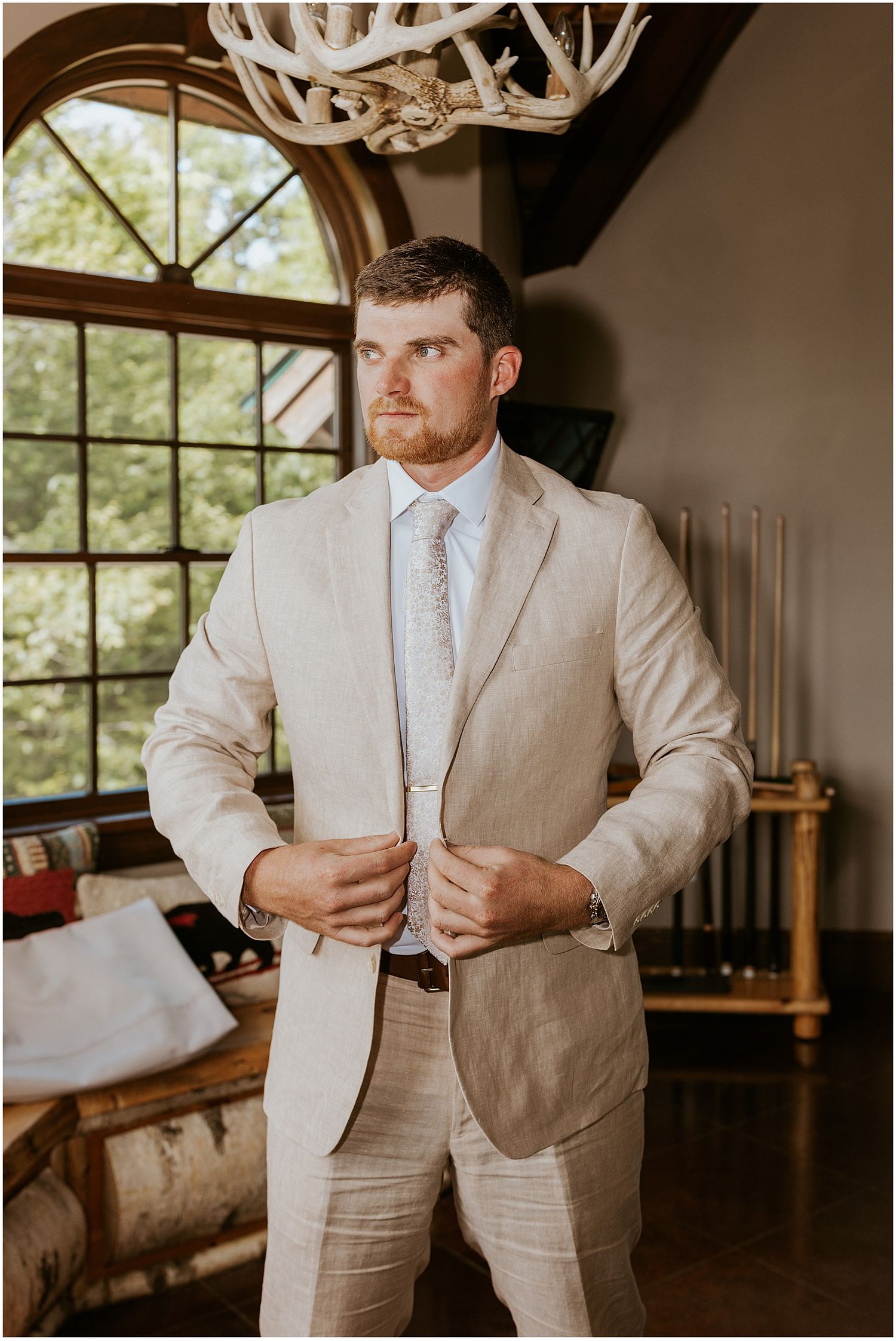 Groom getting ready for his VRBO wedding in Maine