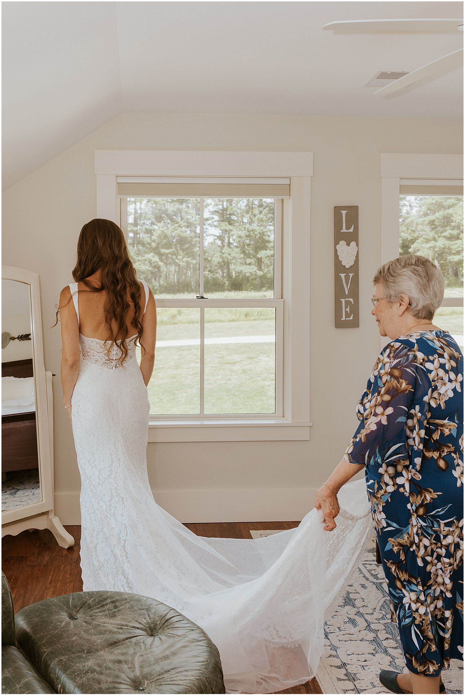 Bride getting ready with her mom for her Whiteface Hollow wedding in the White Mountains of New Hampshire