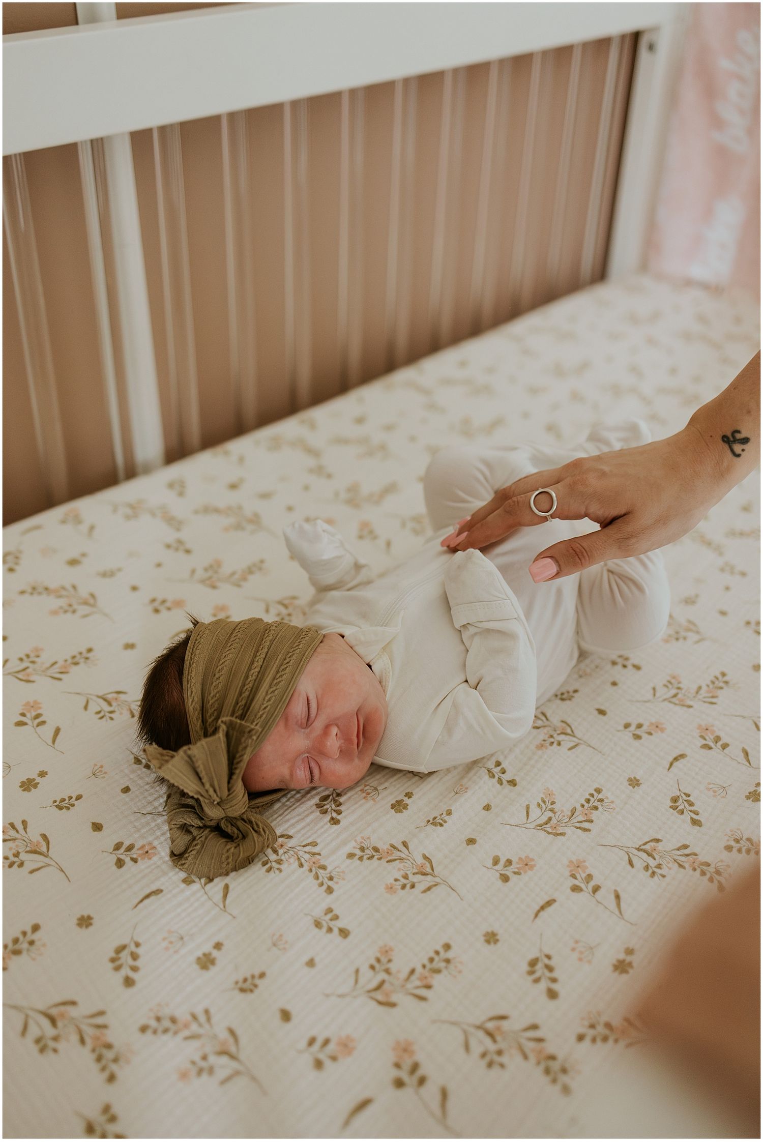 A newborn baby sleeping in her crib at home in New Hampshire