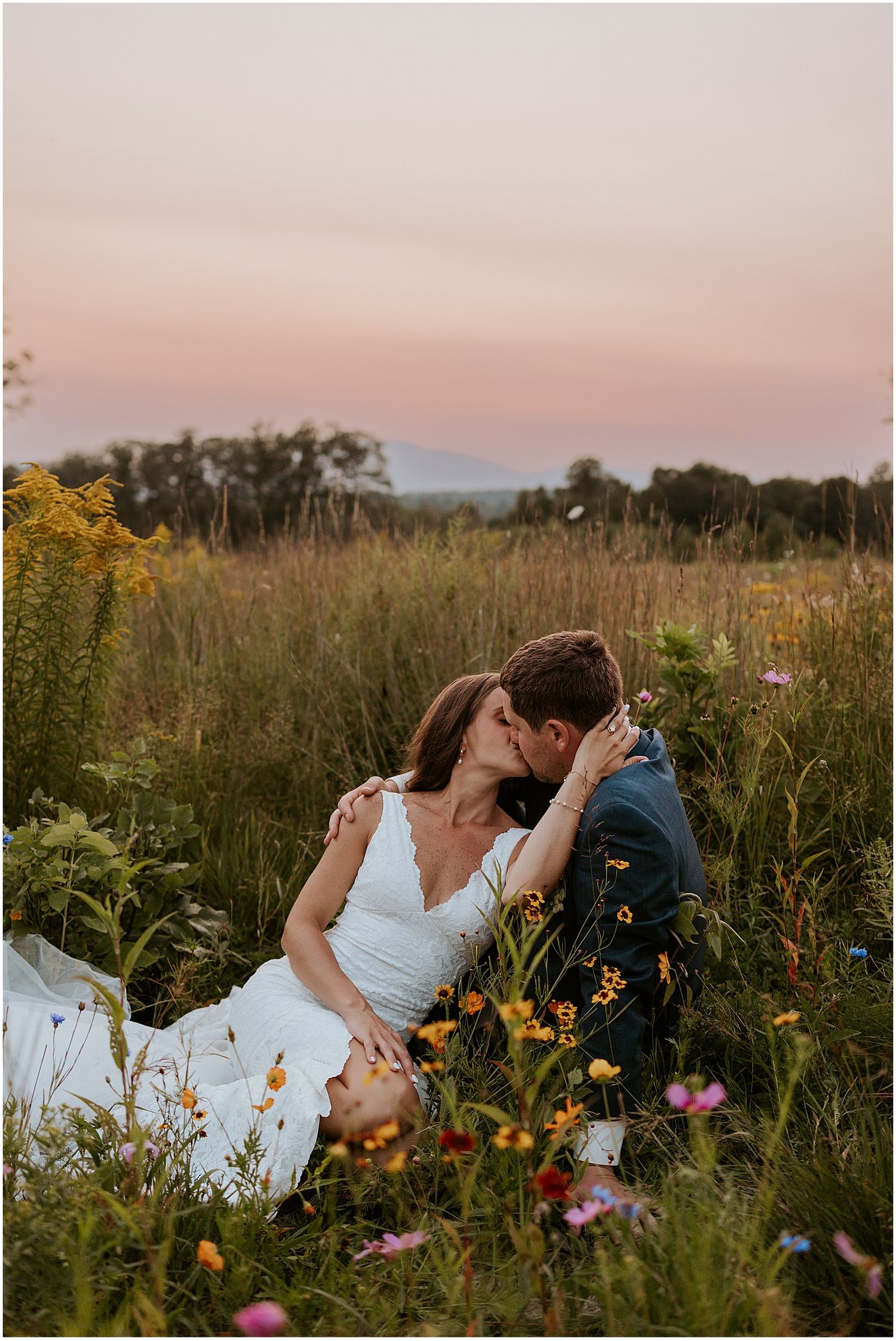 Bride and groom in a wildflower field at their White Mountain wedding