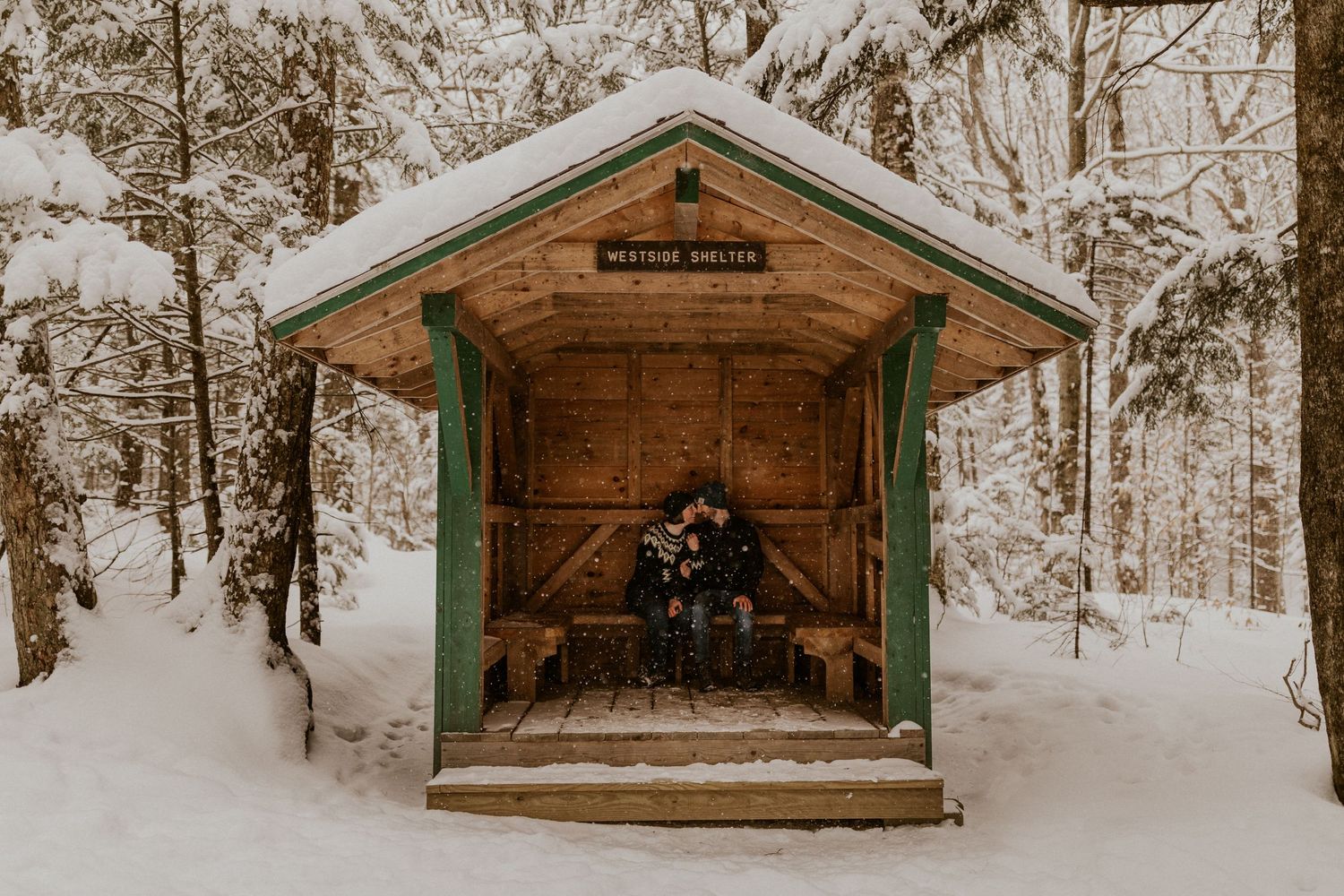 Taylor and Ken snuggling up together in a White Mountain National Forest Shelter while hiking the Flume Gorge in NH.