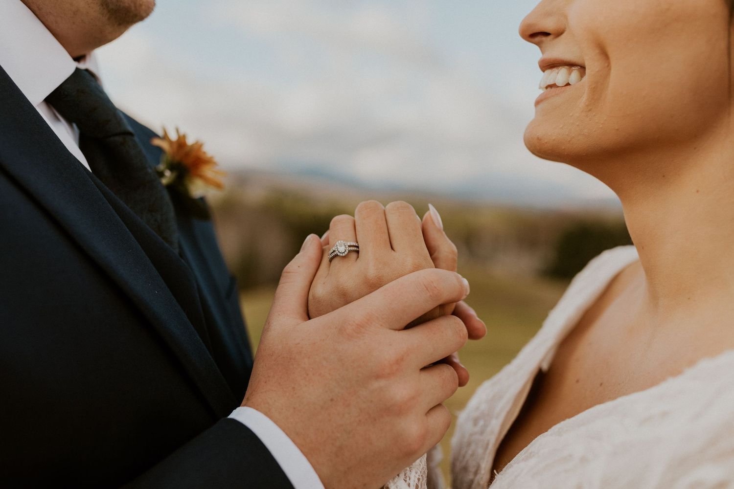 Bride and groom holding each other intimately during portraits at Owl's Nest Resort in Thornton, New Hampshire.