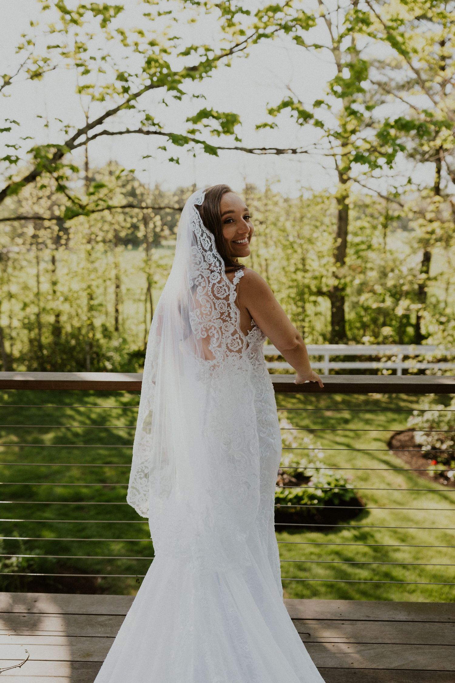 Bride, Chrissy, posing for a bridal portrait before the wedding ceremony