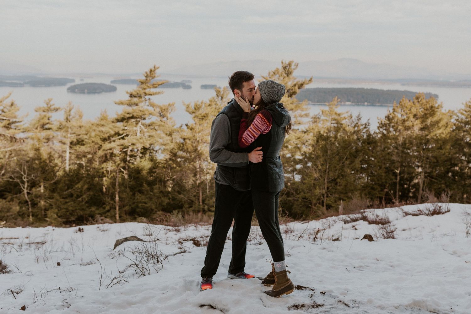 Ivan and Kirsten sharing a mountain top kiss in Gilford New Hampshire.