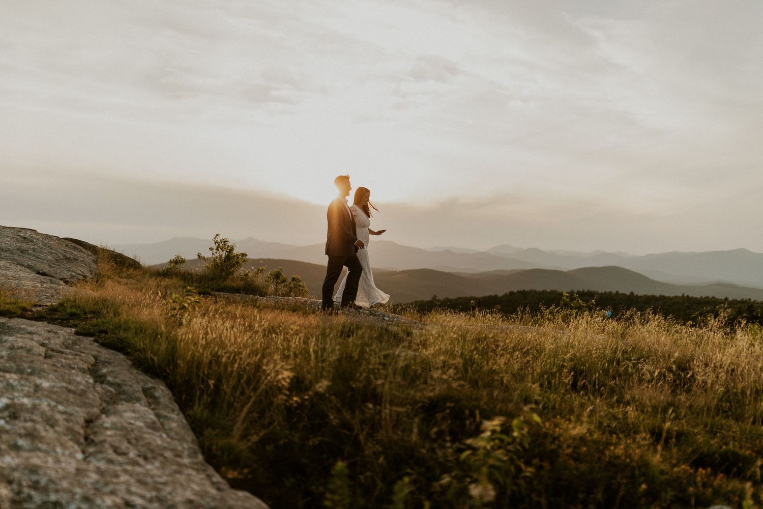 Danielle and Colin dressed in their wedding attire for their one year anniversary photoshoot on Foss Mountain in NH.