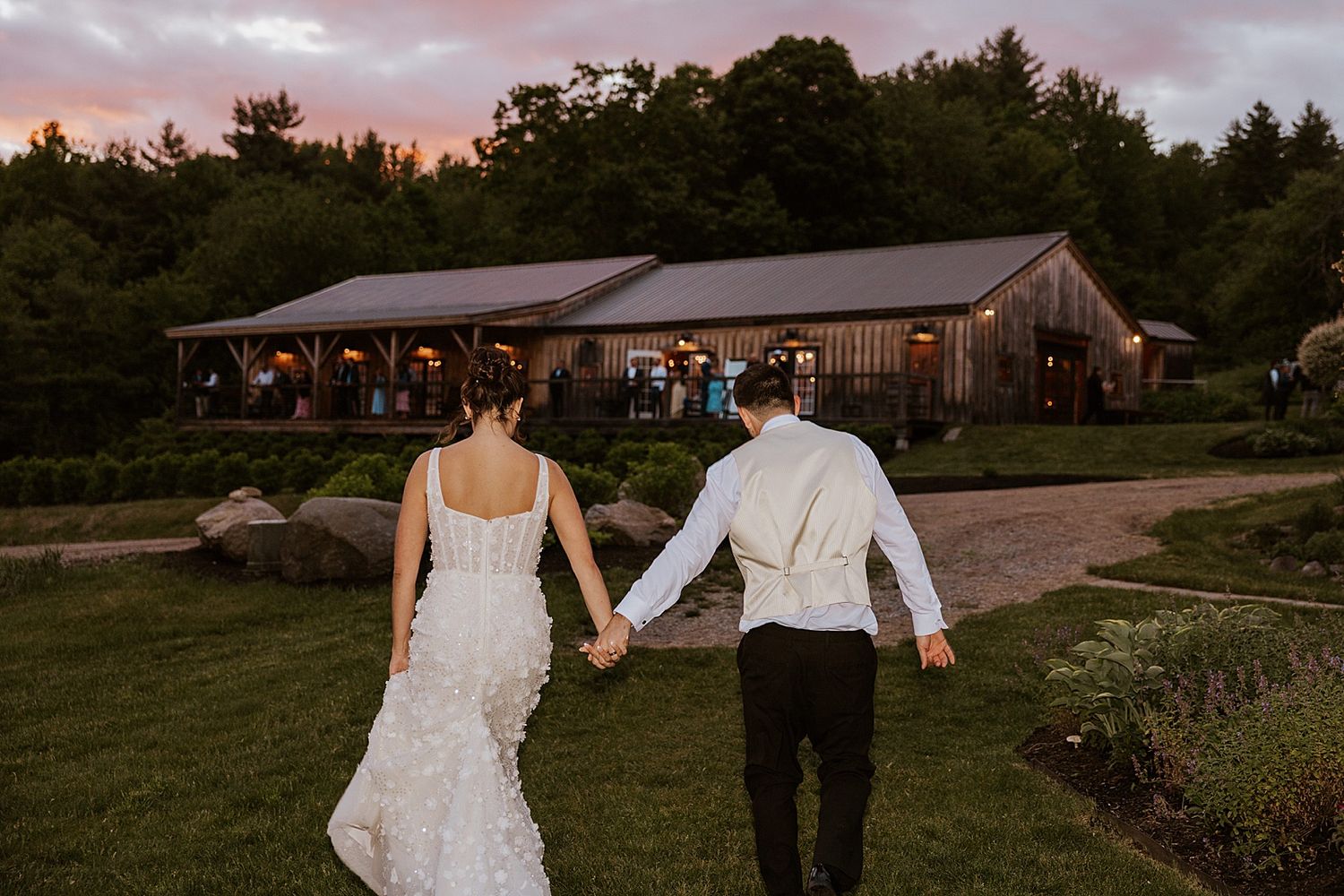 Bride and groom taking sunset portraits at Longlook Farm in NH