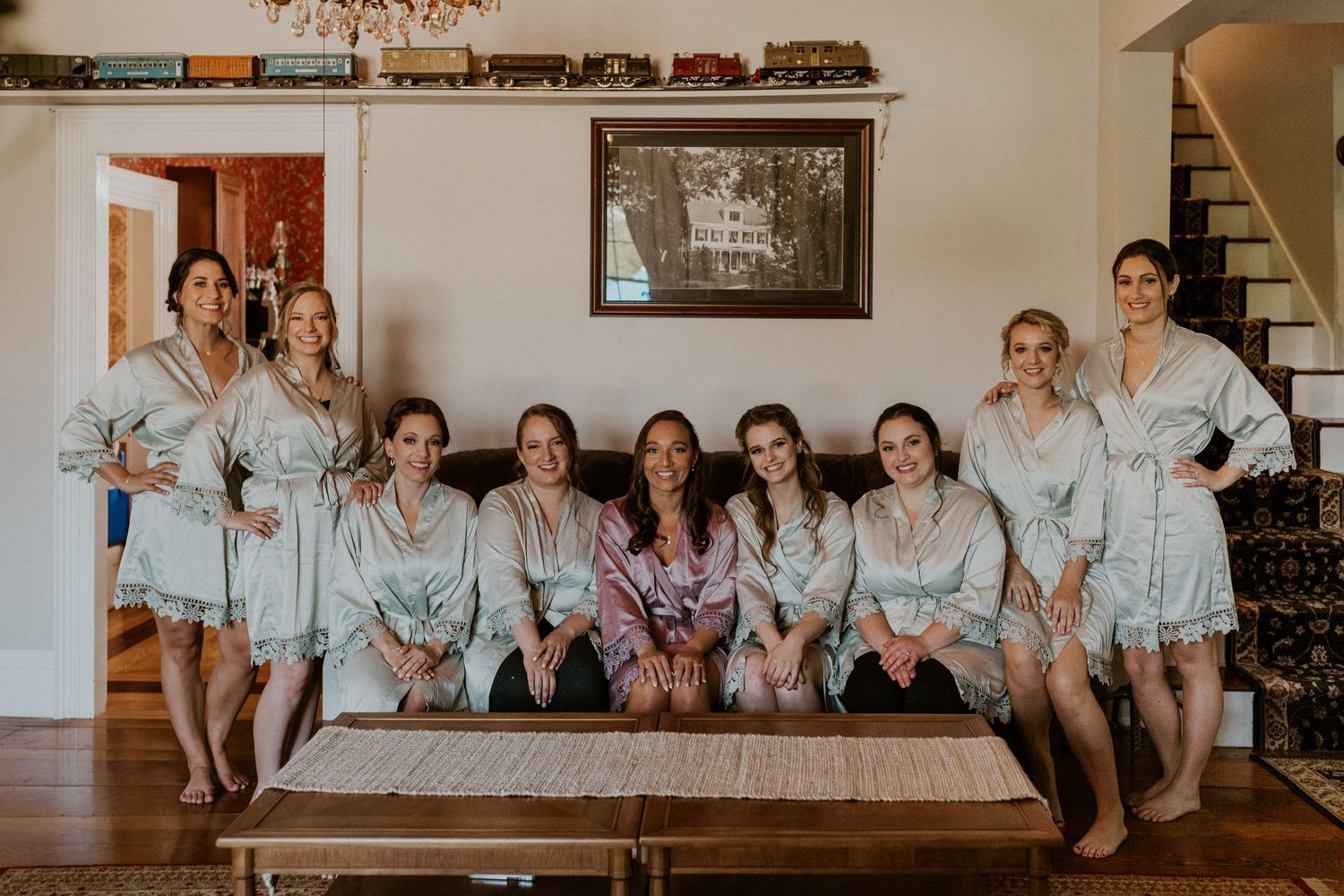 A photo of Chrissy and all of her bridesmaids in their getting ready robes.