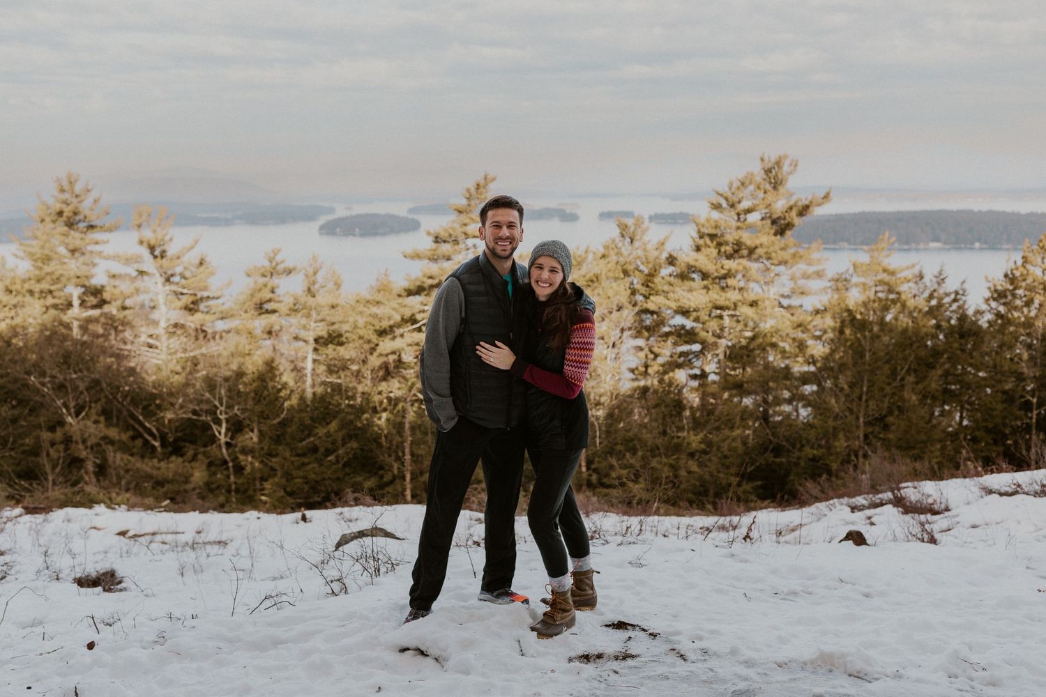 The newly engaged couple posing for some photos on Lockes Hill Trail in Gilford New Hampshire.