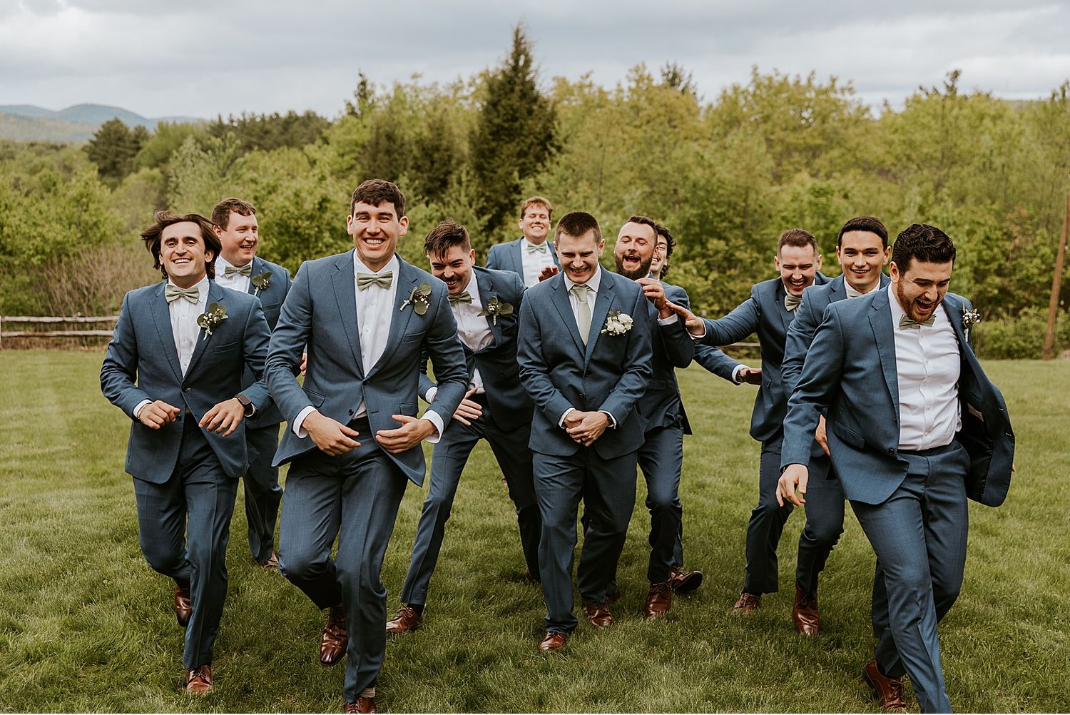 Groom and groomsmen taking portrait photos at the Barn on the Pemi in NH