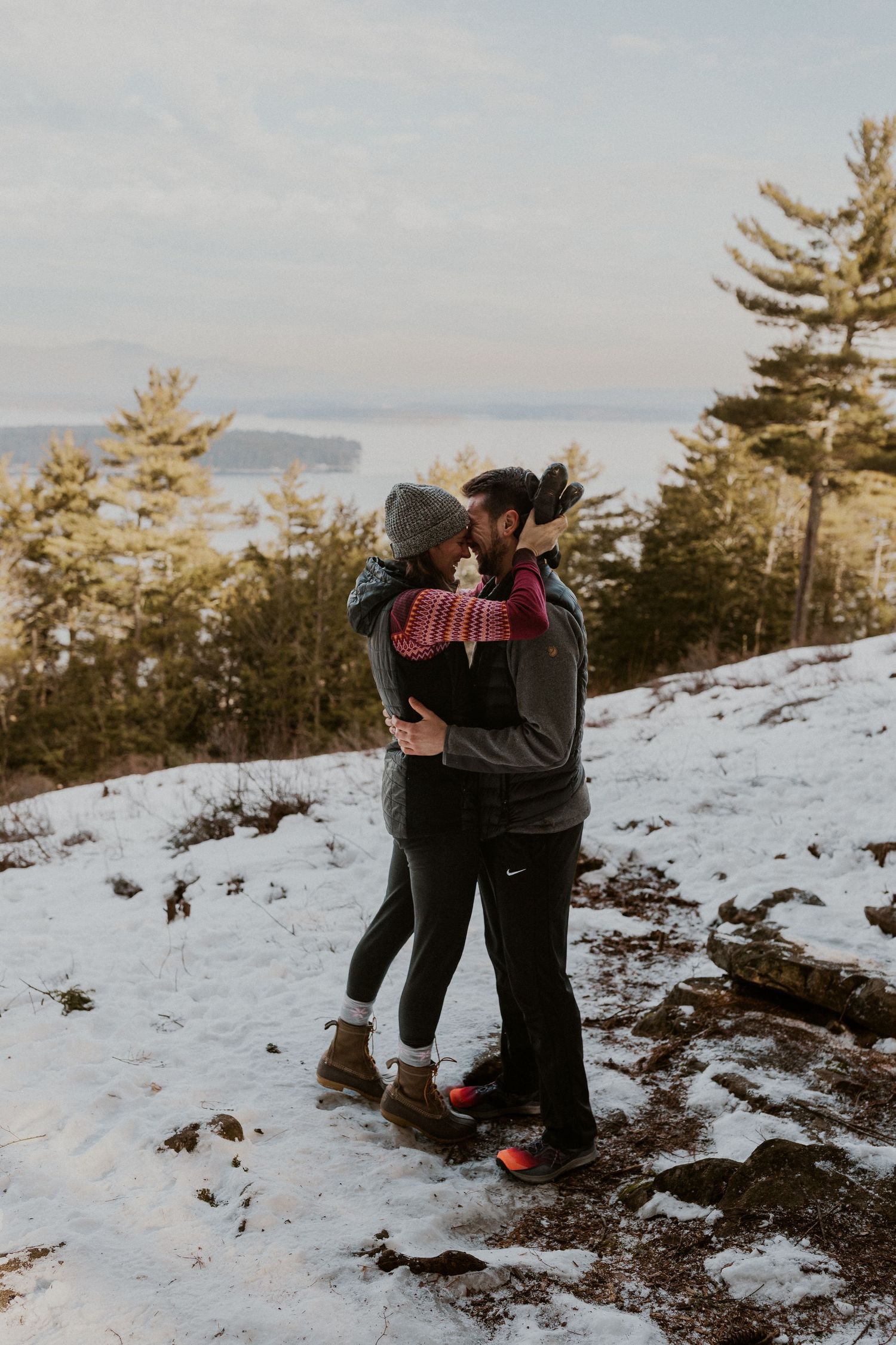 Kirsten hugging onto Ivan after he proposed to her on Lockes Hill Trail in Gilford New Hampshire.