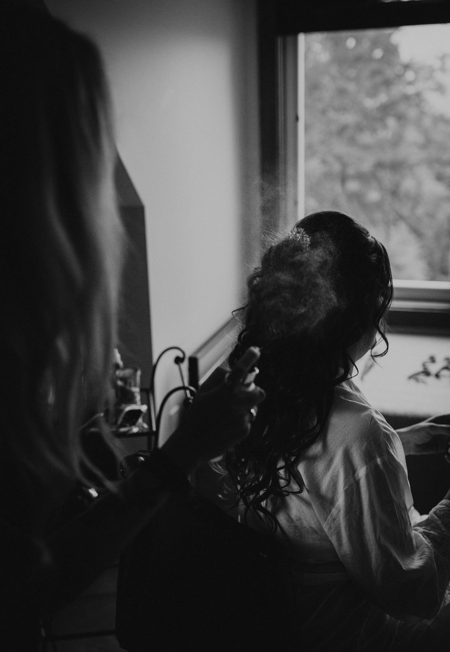 bride getting ready before her wedding ceremony in the white mountains of new hampshire.