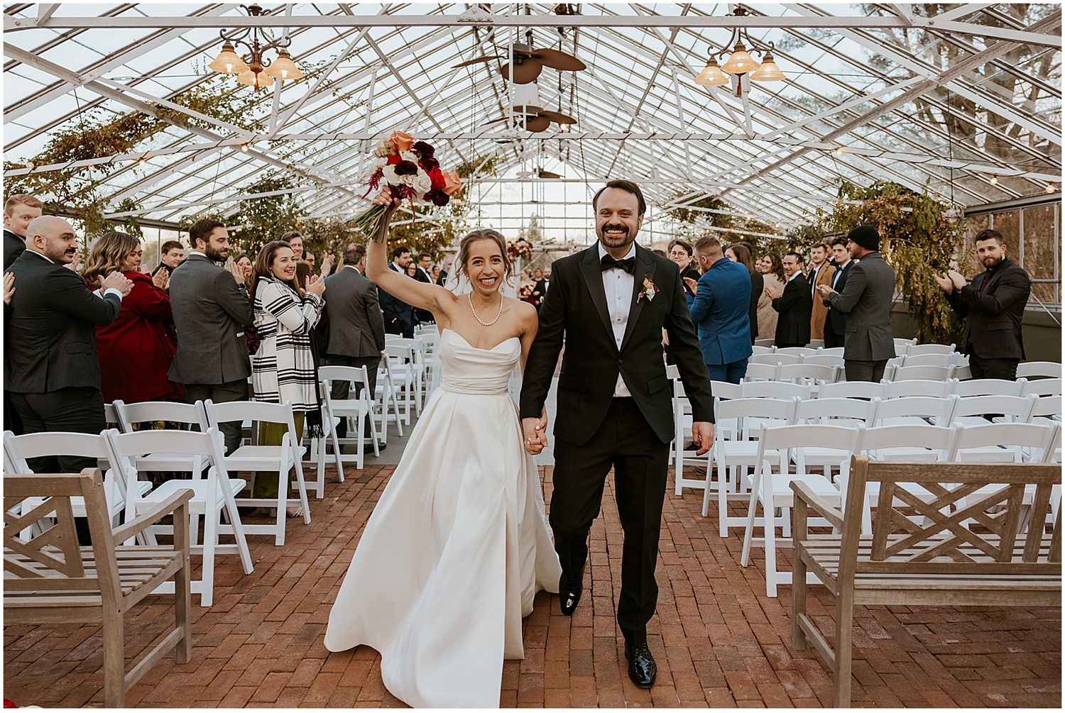 Bride and groom at their wedding ceremony at the Barn on the Pemi