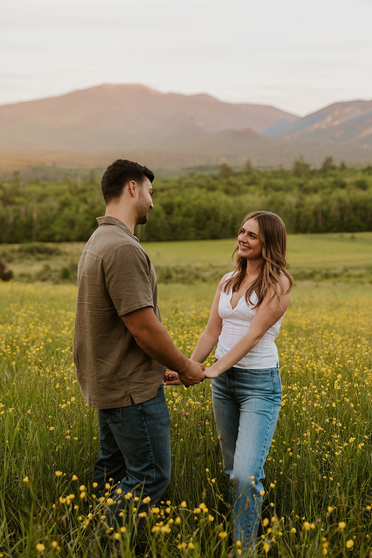New Hampshire couple taking White Mountain engagement photos at golden hour