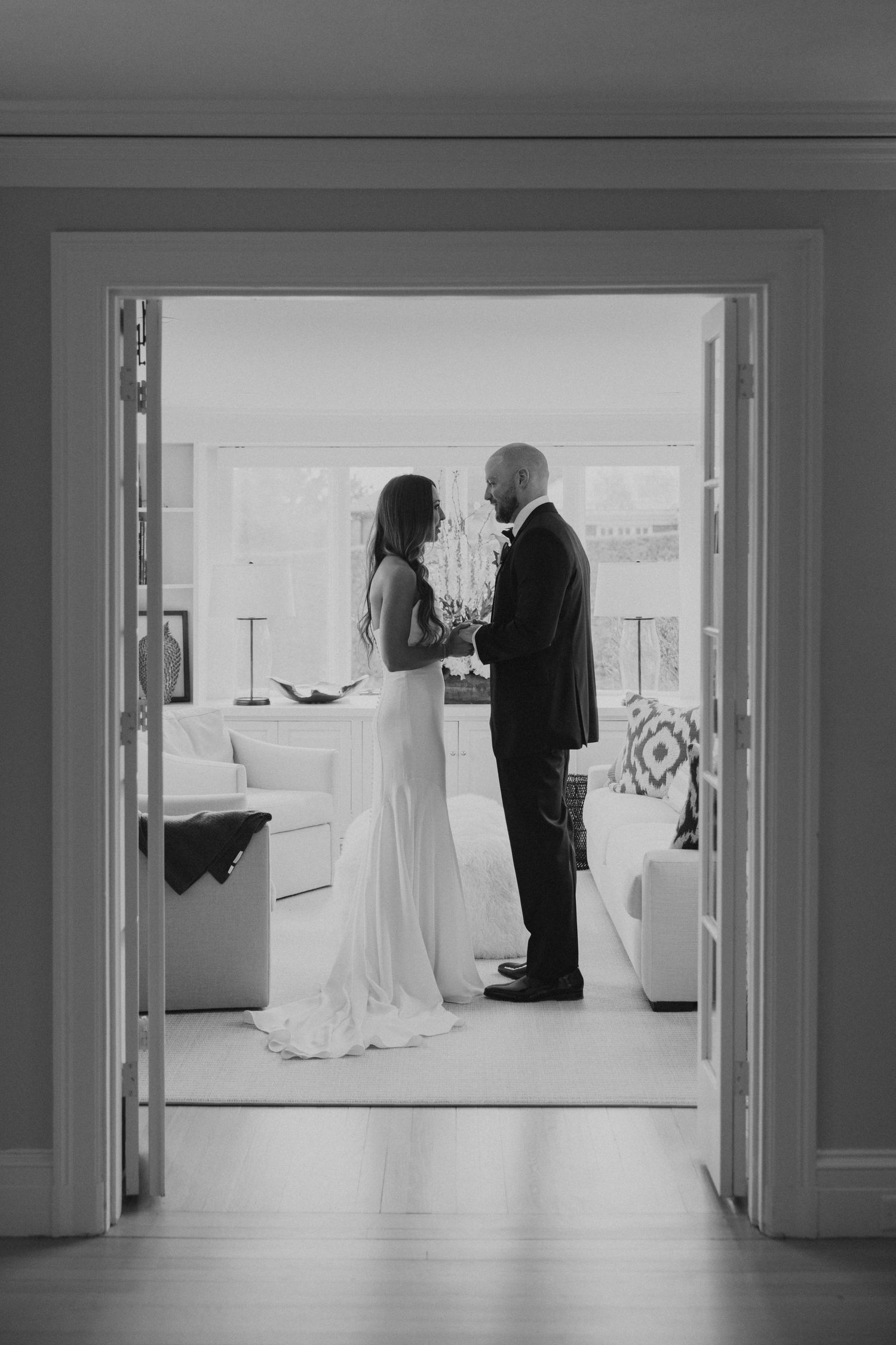 A sequence of black and white wedding photos showing silhouettes in a hallway.