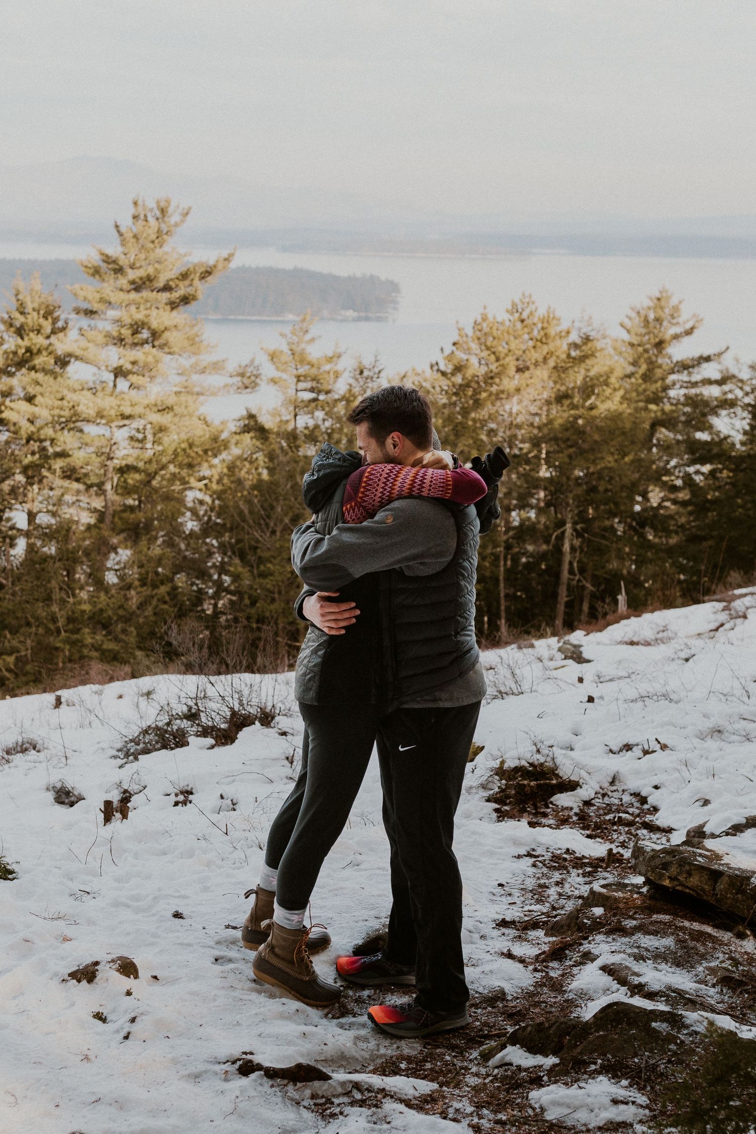 Kirsten hugging onto Ivan after he proposed to her on Lockes Hill Trail in Gilford New Hampshire.