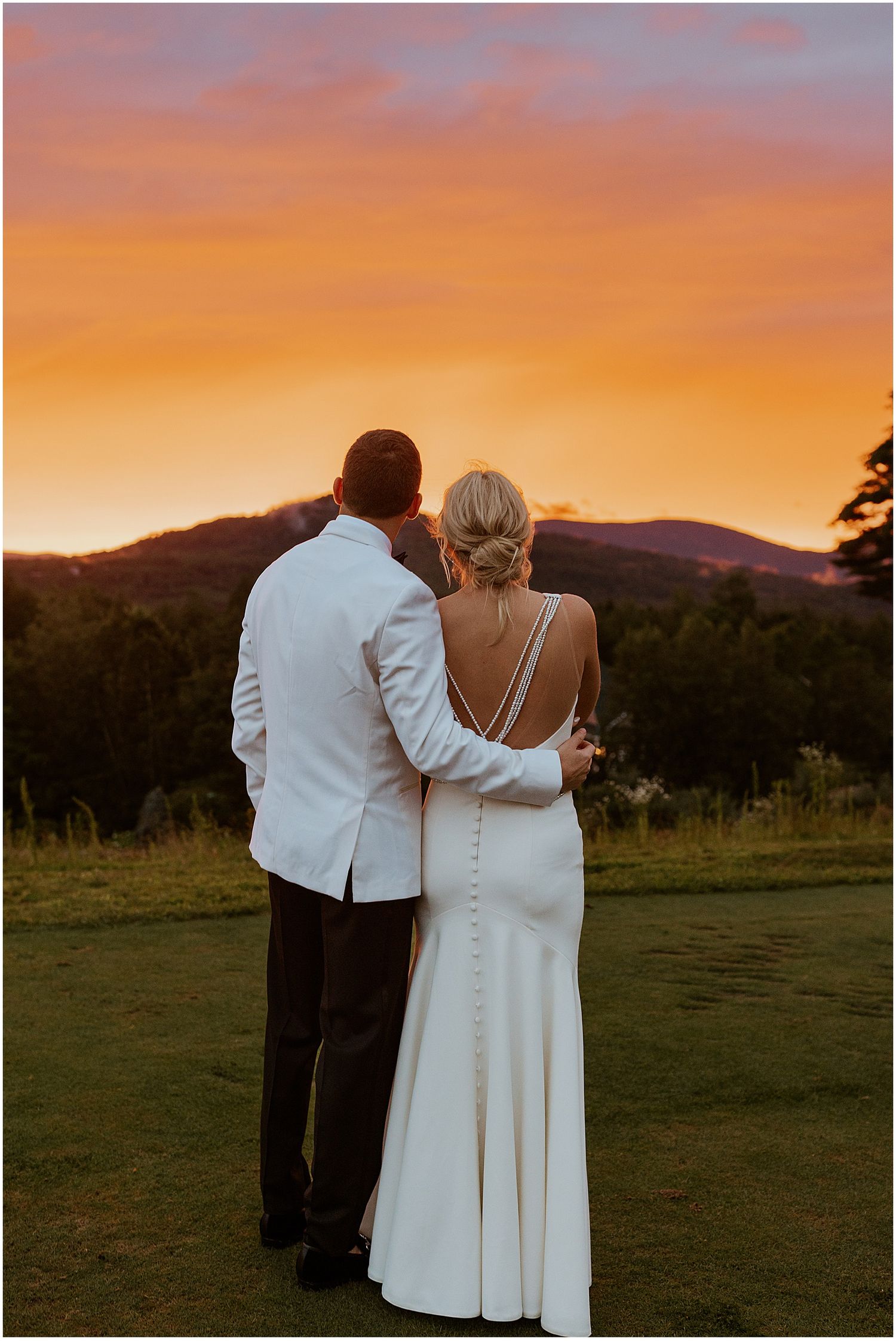 Bride and groom at sunset at their White Mountains wedding