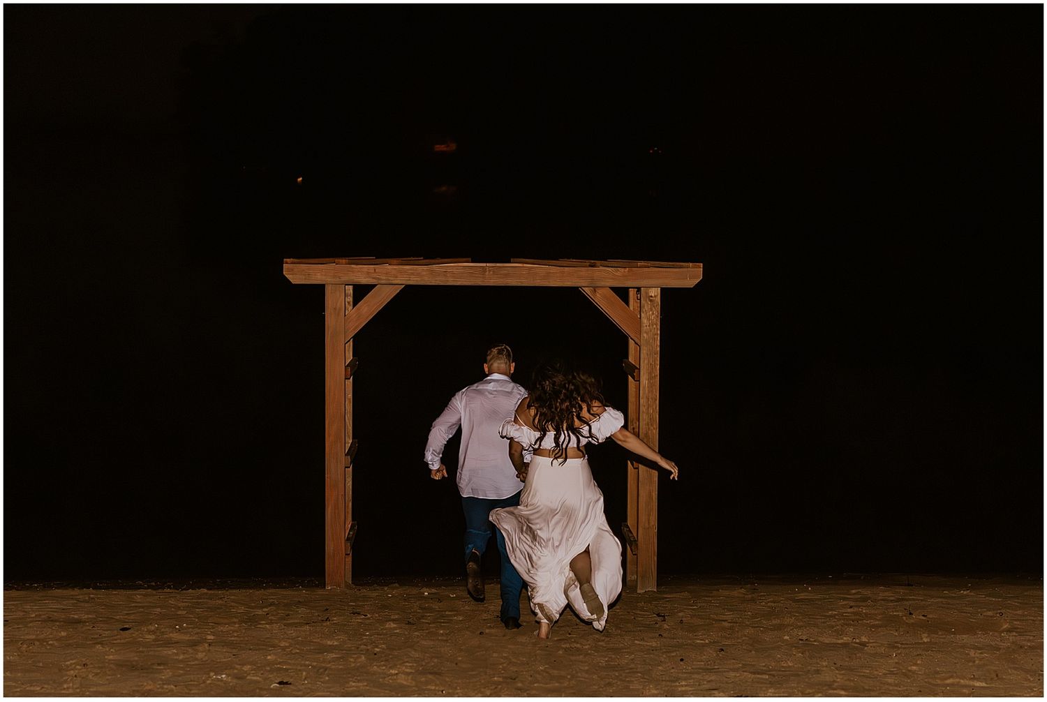 Couple jumping in the lake after their Lakeshore Village Resort wedding