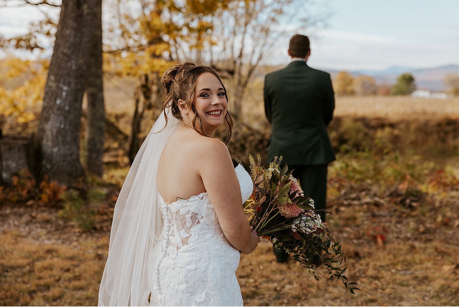 Bride and groom taking first look wedding photos at their NH wedding