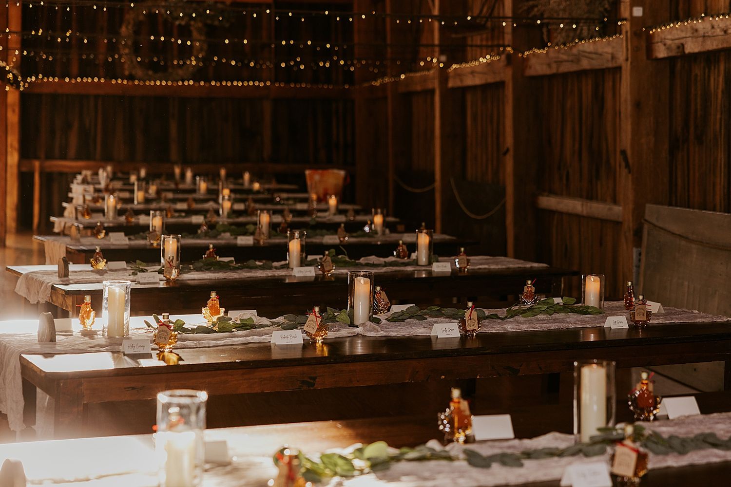 Rustic barn wedding reception decor for a NH wedding at the Barn at Powder Major's Barn