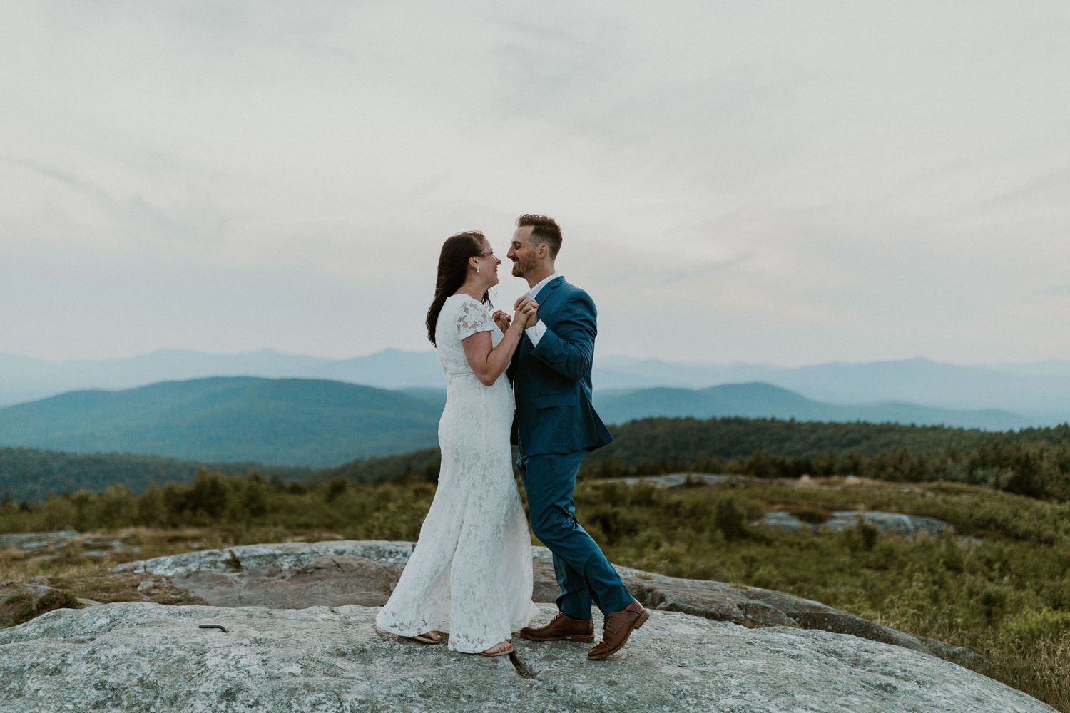 Danielle and Colin dressed in their wedding attire for their one year anniversary photoshoot on Foss Mountain in NH.