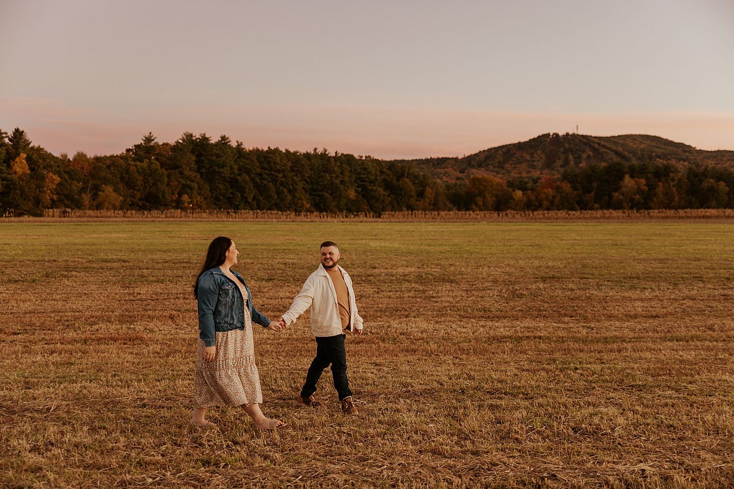 Couple taking family photos in New Hampshire