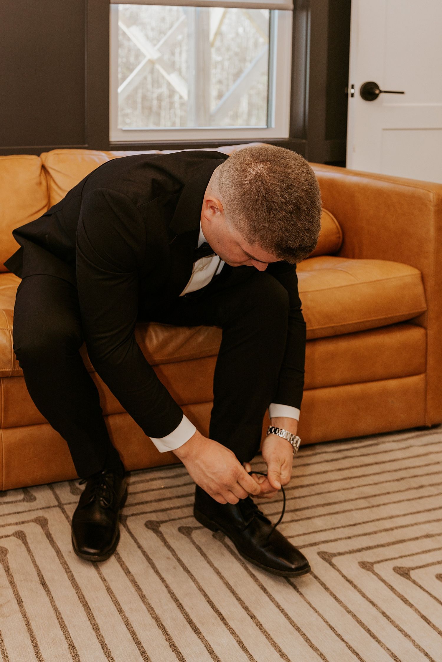 Groom getting dressed for his Hyla Brook Estate wedding in NH