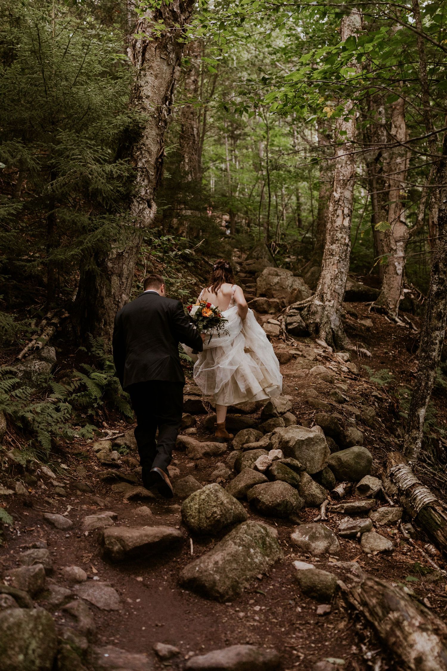 The bride and groom on their way up to the top of Artist Bluff for adventure portraits.