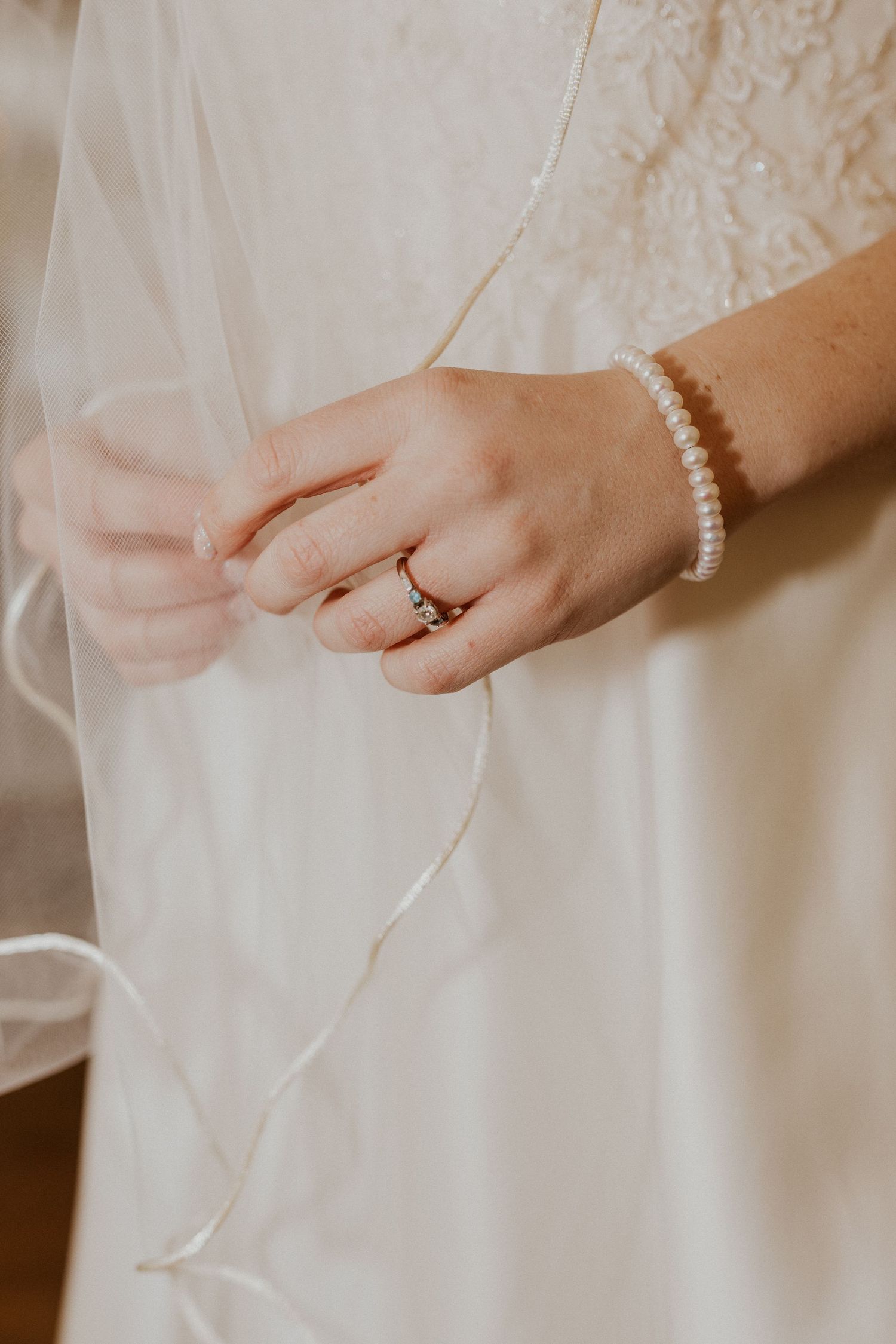 Deirdre anxioulsy holding her veil as she waits for the wedding ceremony.