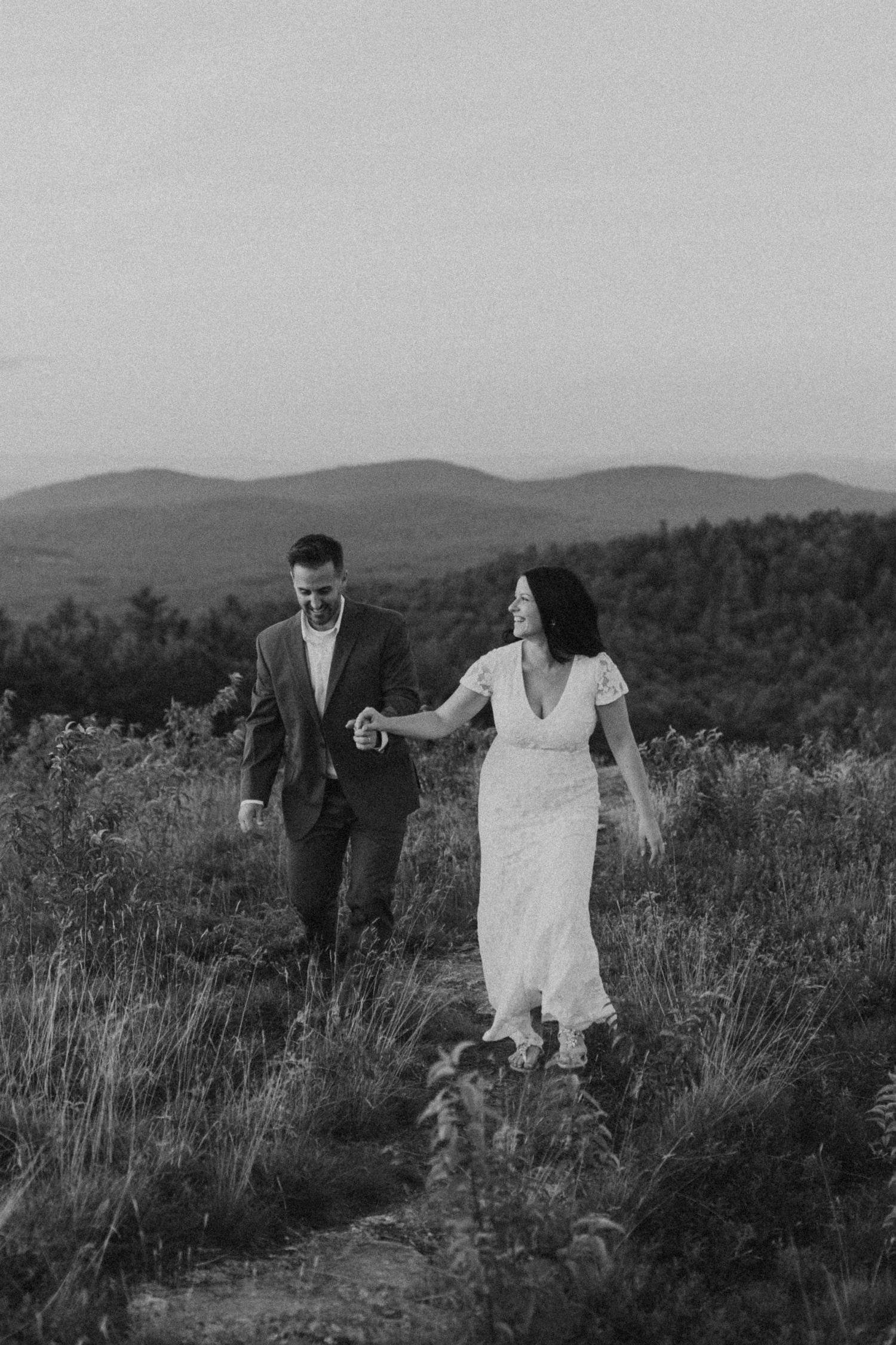 Danielle and Colin dressed in their wedding attire for their one year anniversary photoshoot on Foss Mountain in NH.