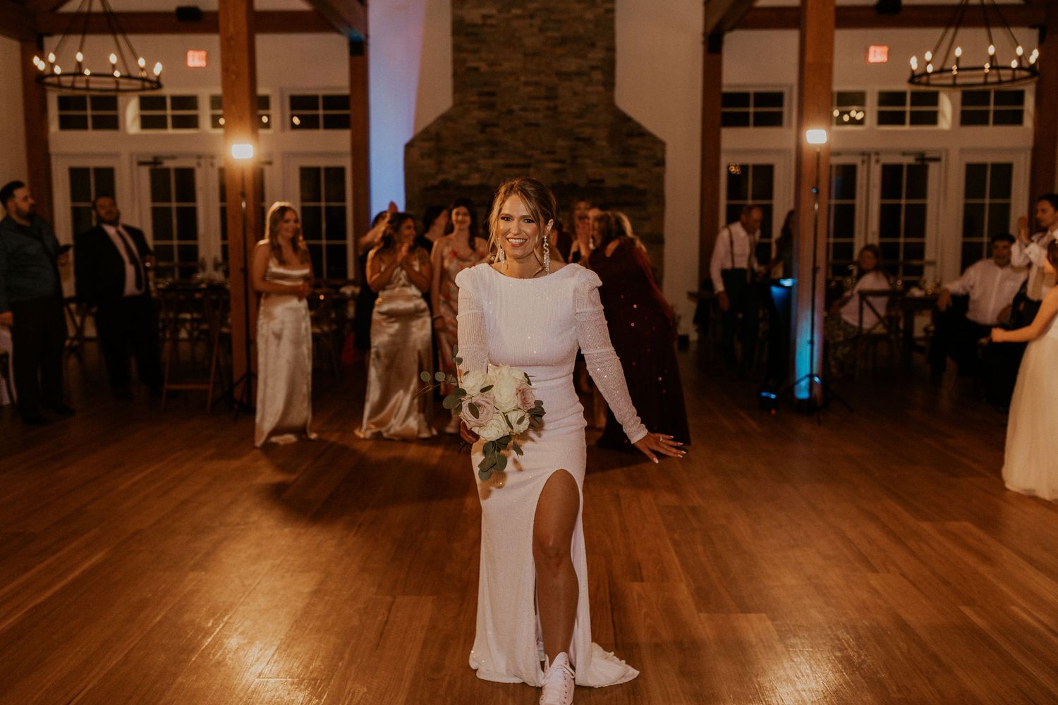 Kendra the bride tossing her bouquet toward all the single ladies!