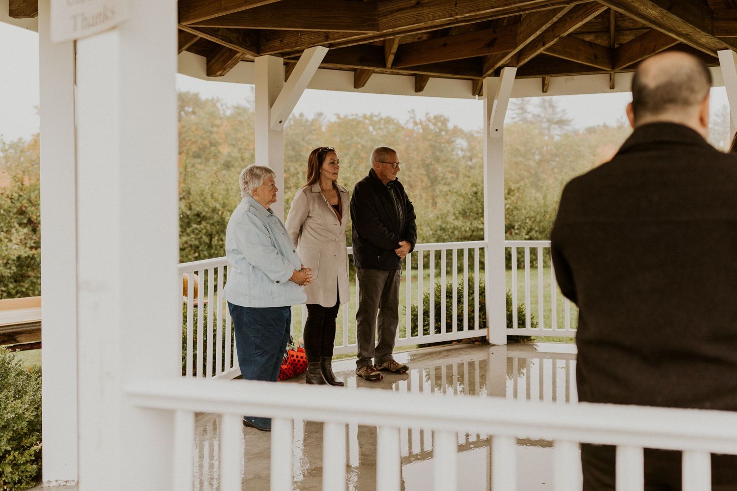 Family members watching their ceremony at Carter Hill Orchard in Concord New Hampshire.