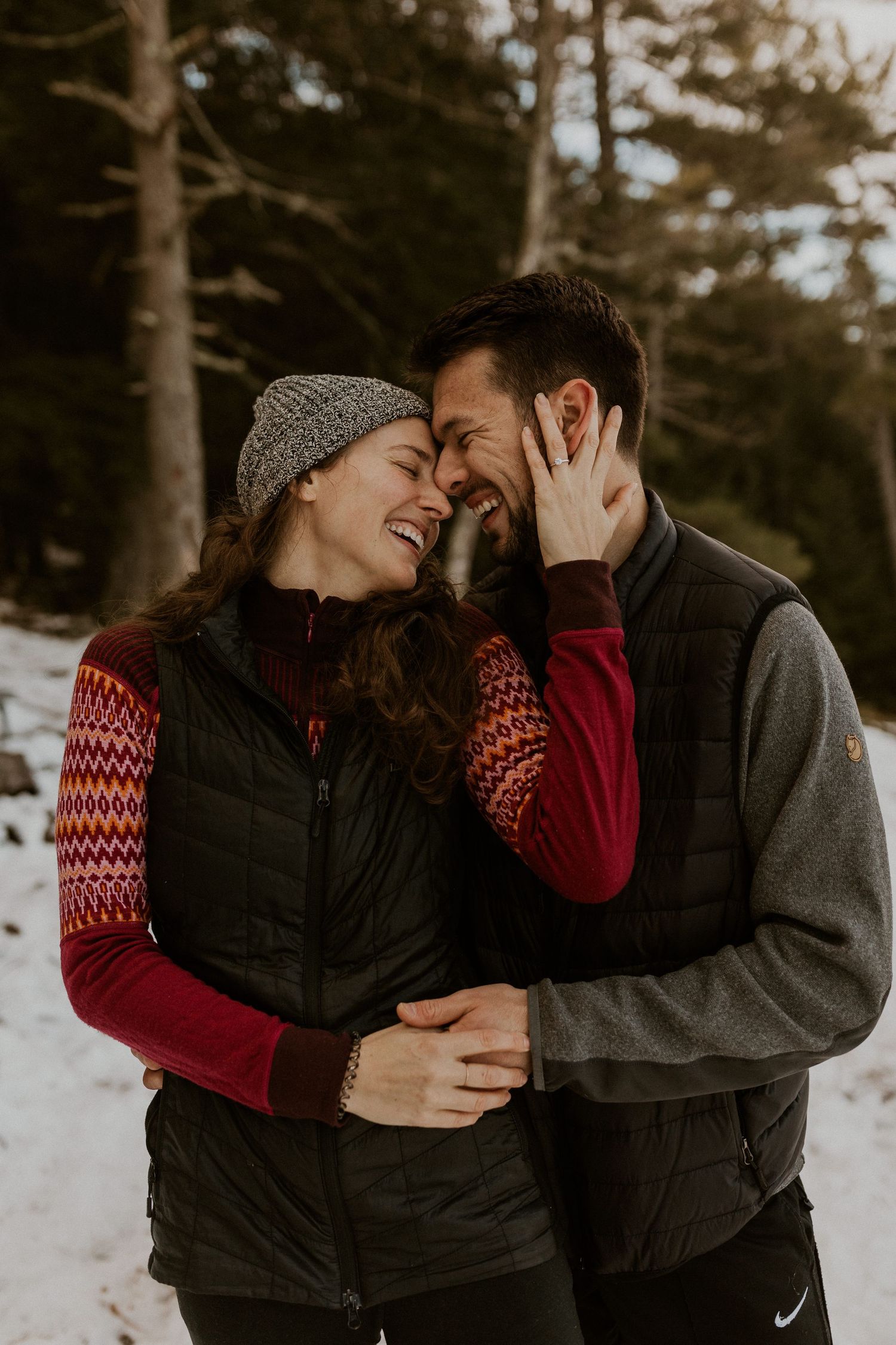 Kirsten and Ivan intimately holding each other and smiling.