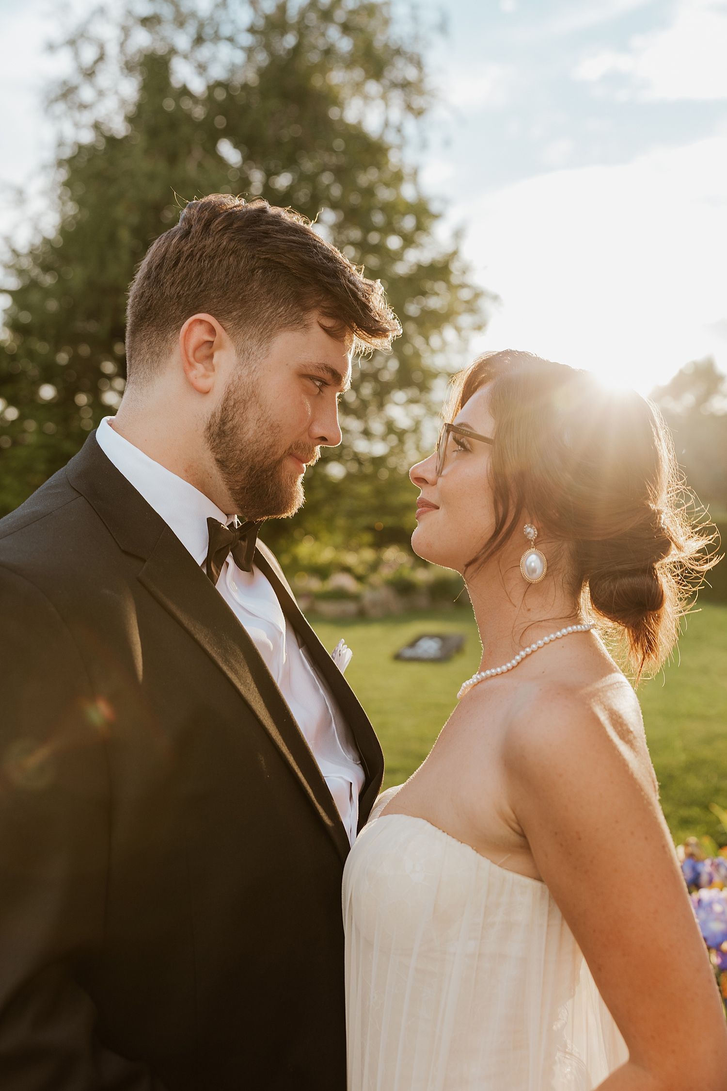 Bride and groom taking sunset portraits at Dell-Lea Weddings & Events