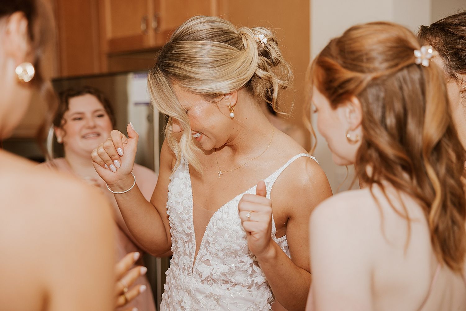 Bride getting ready with her bridesmaids for her wedding at the Sunset Pavilion at the Owl's Nest Resort in New Hampshire