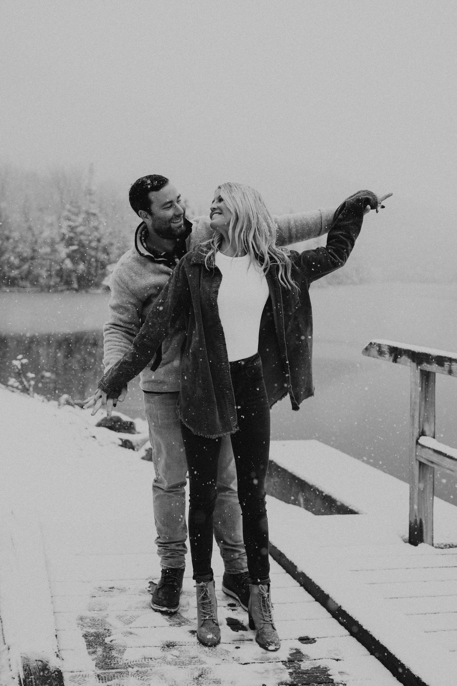 Newly engaged couple playfully posing for photos during their engagement session in Franconia New Hampshire.