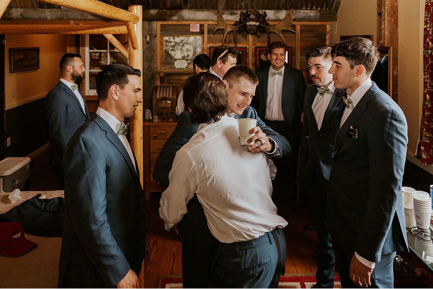 Groom and groomsmen getting ready for a Barn on the Pemi wedding
