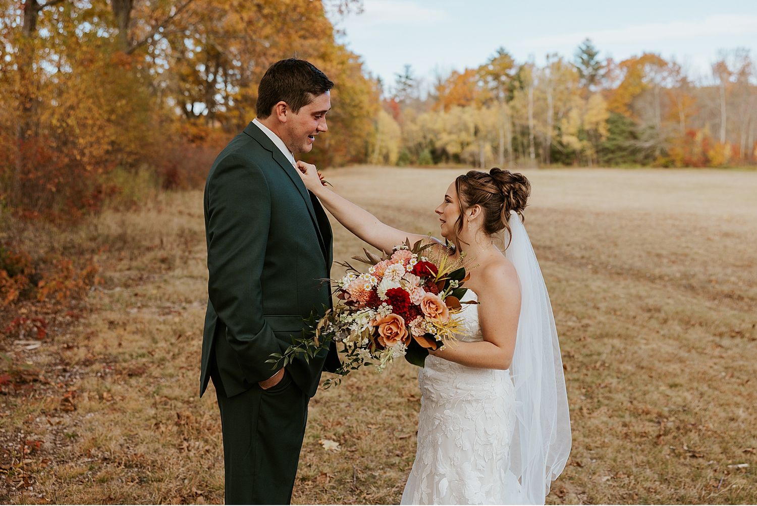 Bride and groom taking first look wedding photos at their Maine wedding