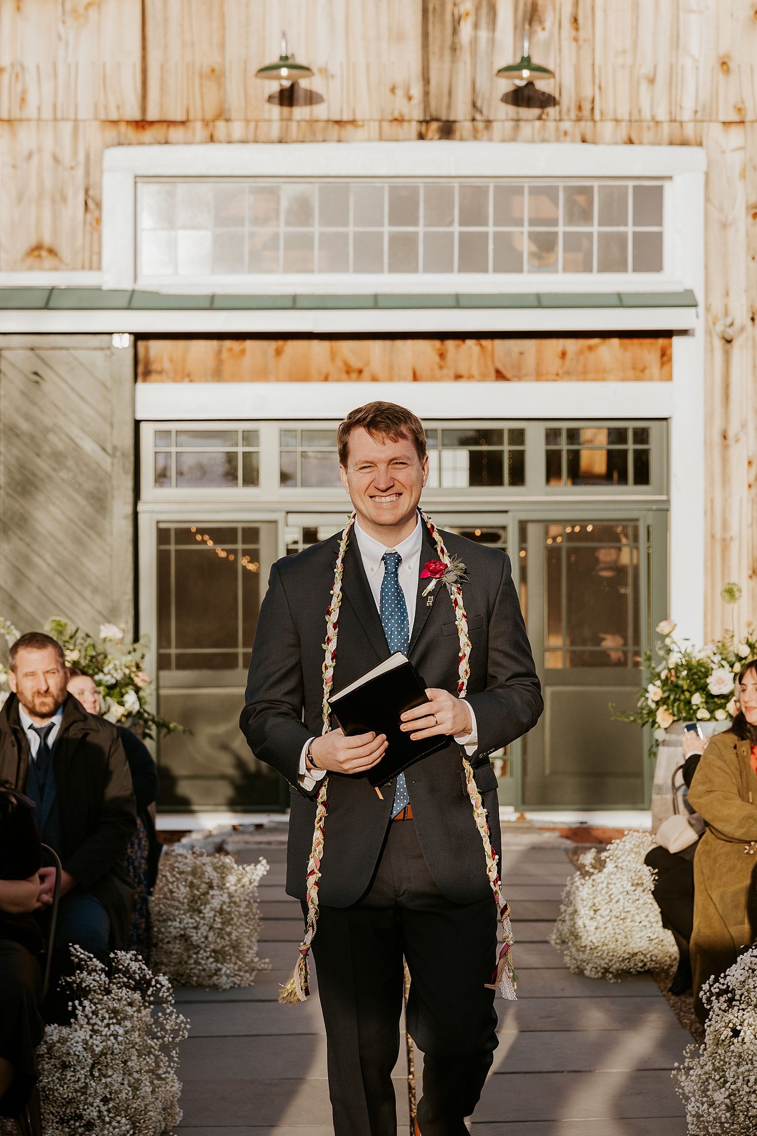 Officiant getting ready for a New Hampshire wedding ceremony at the Barn at Powder Major's Farm