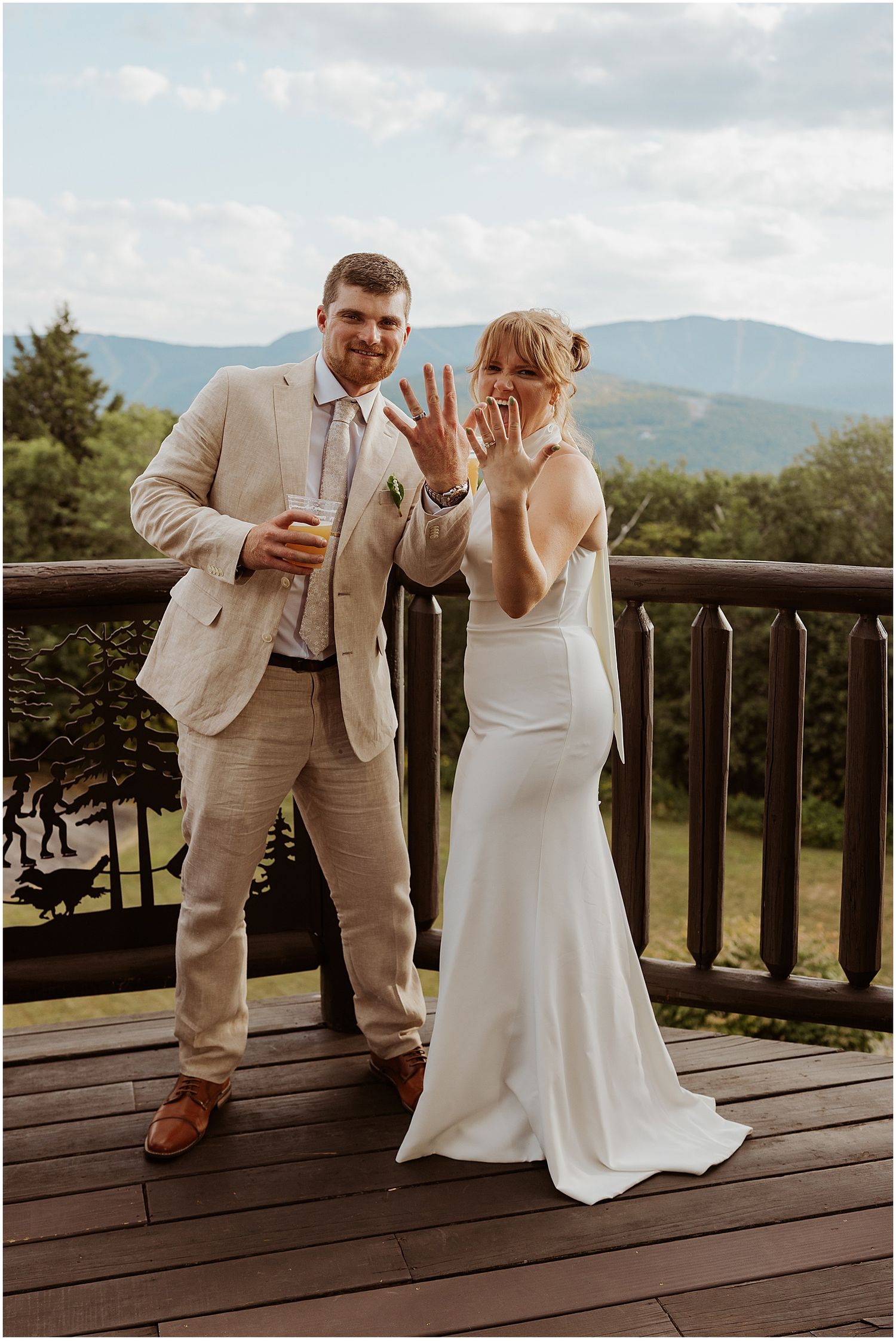 Bride and groom on the deck at their VRBO on their wedding day