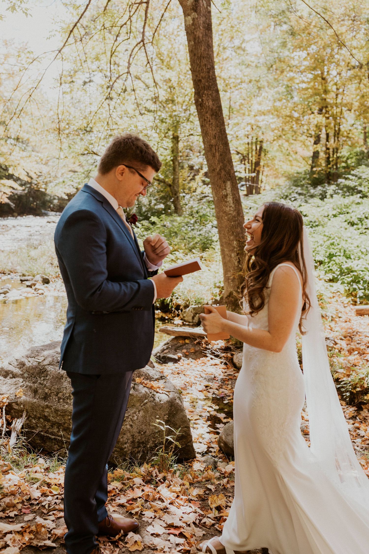 Daniel reading his private vows to Briana along the Pemi River in Woodstock New Hampshire.