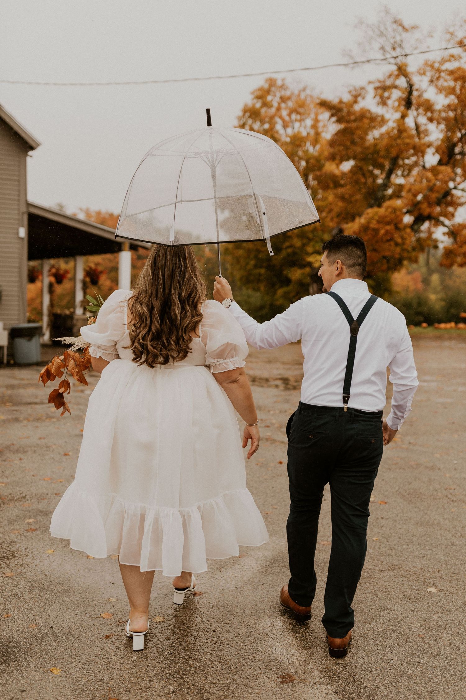 Terise and Jose walking up to greet their family members before their elopement in Concord New Hampshire.