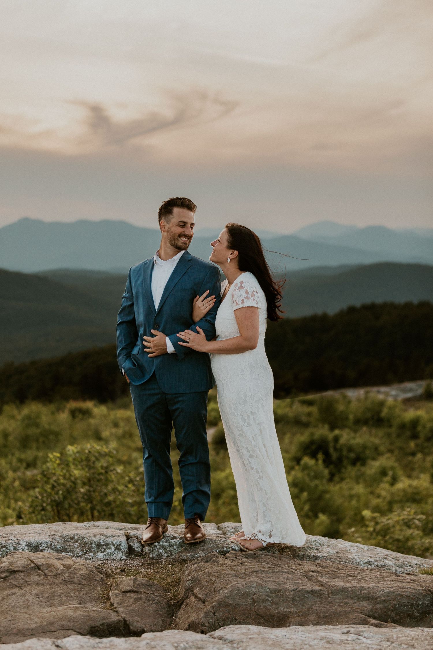 Danielle and Colin dressed in their wedding attire for their one year anniversary photoshoot on Foss Mountain in NH.