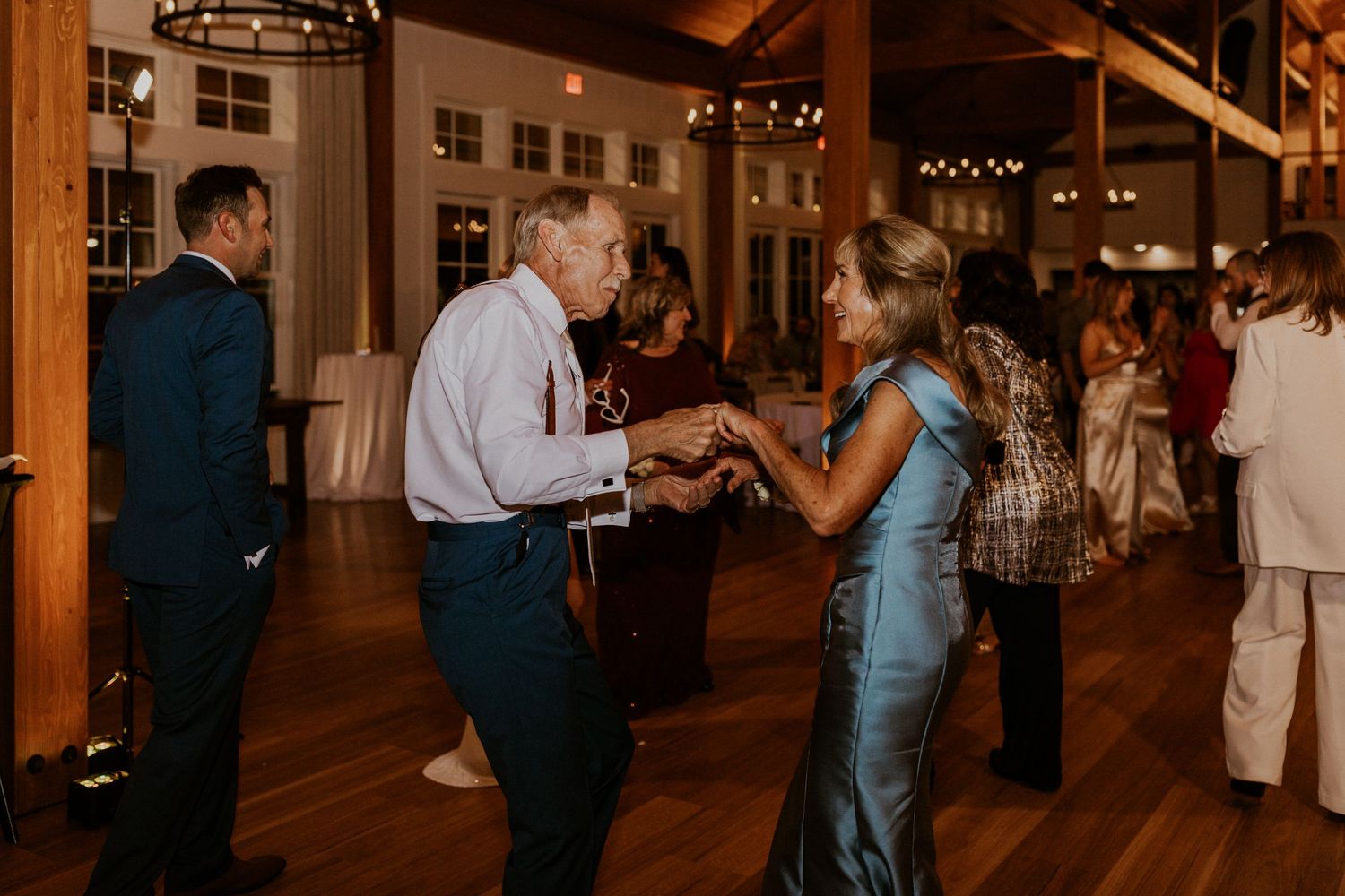 The grooms parents out on the dance floor having a great time together!
