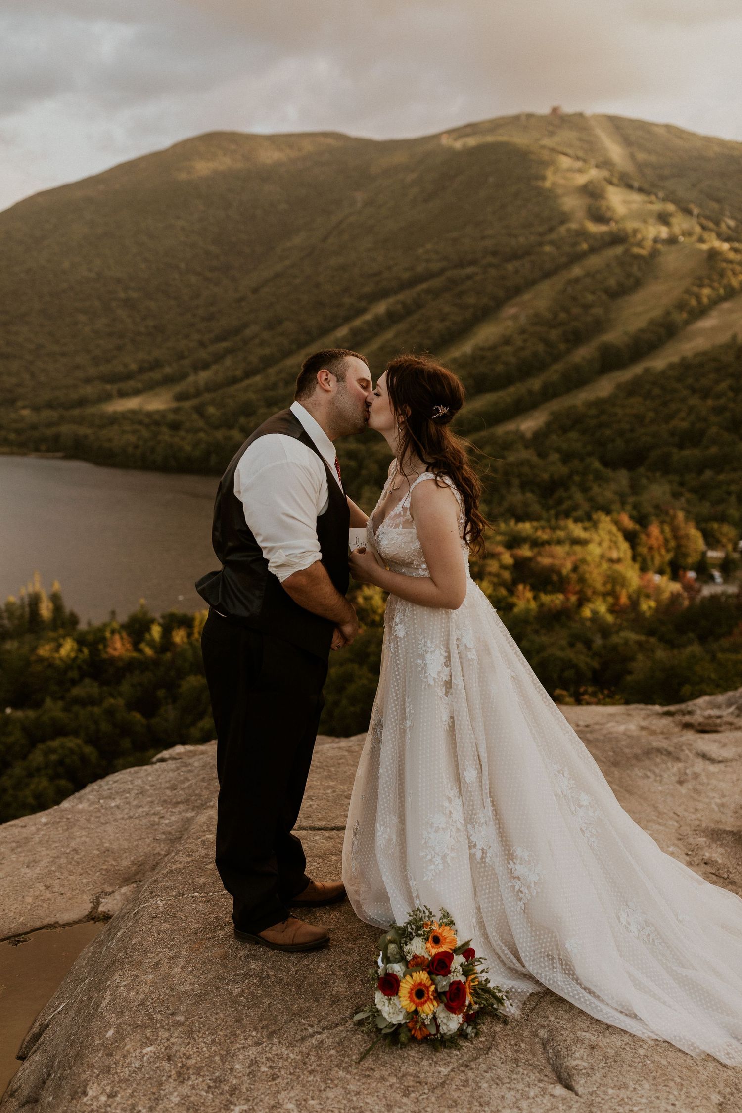 Bride and groom sharing a kiss on Artist Bluff after sharing private vows together.