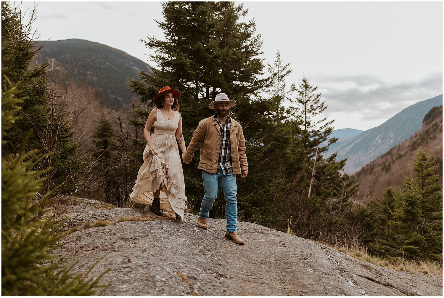 Couple taking mountain engagement photos in NH