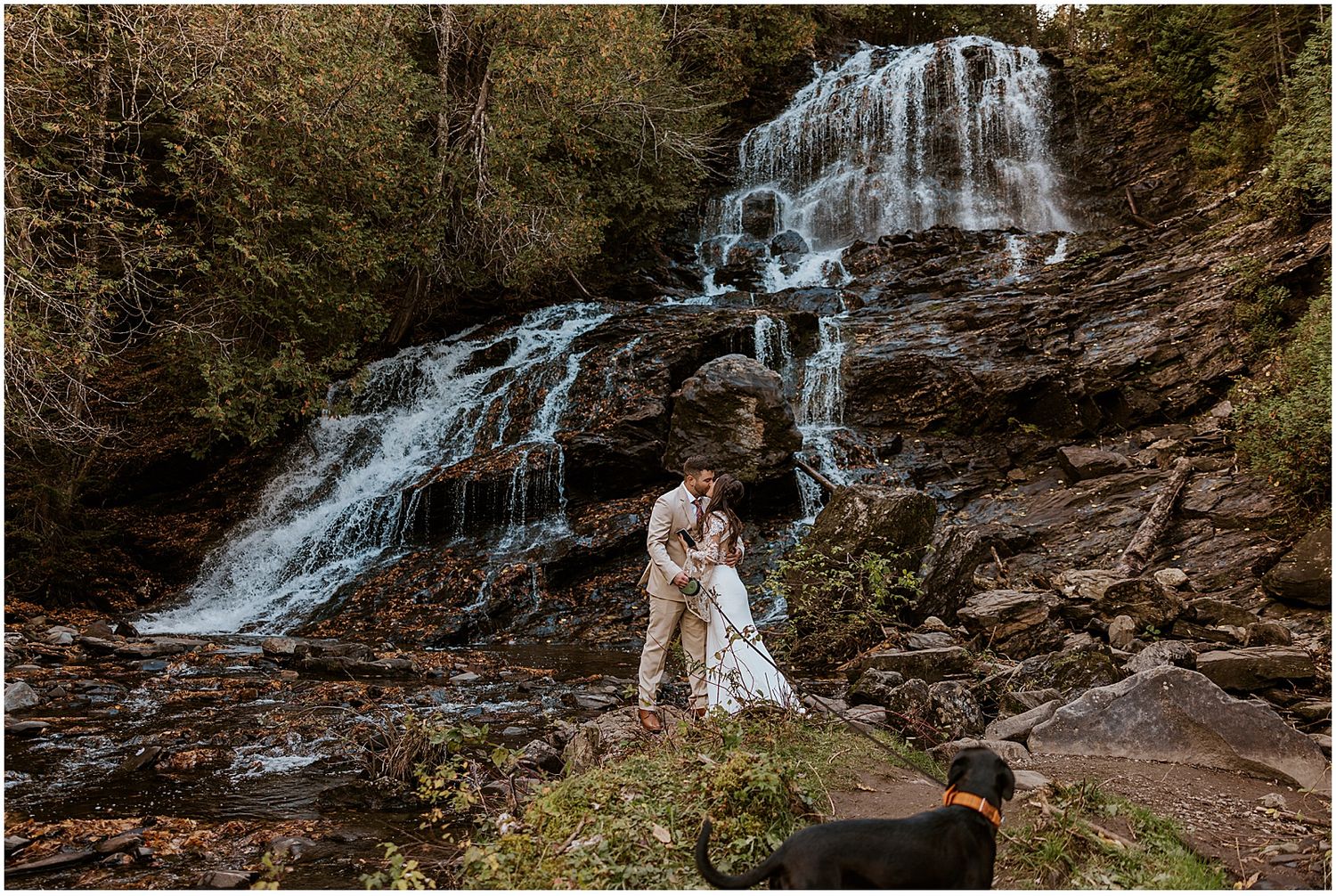 A bride and groom sharing a first look by a NH waterfall - unique wedding ideas