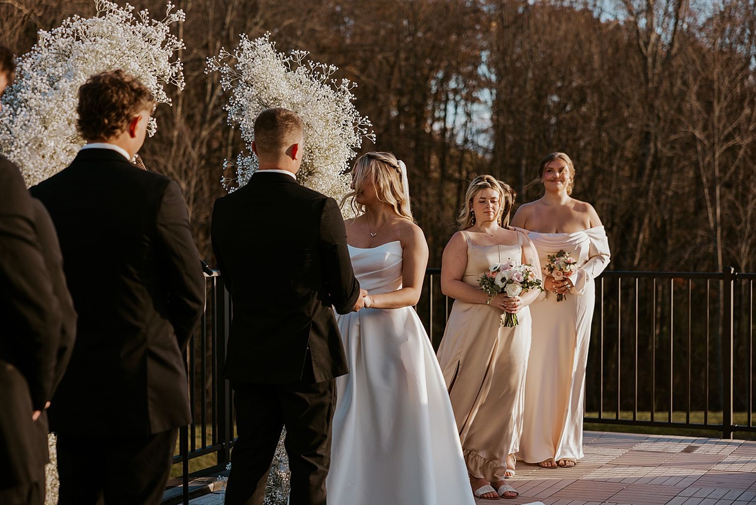 Bride and groom at their wedding ceremony at Hyla Brook Estate